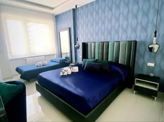 Bed in DISTINTO SUITE & ROOMS