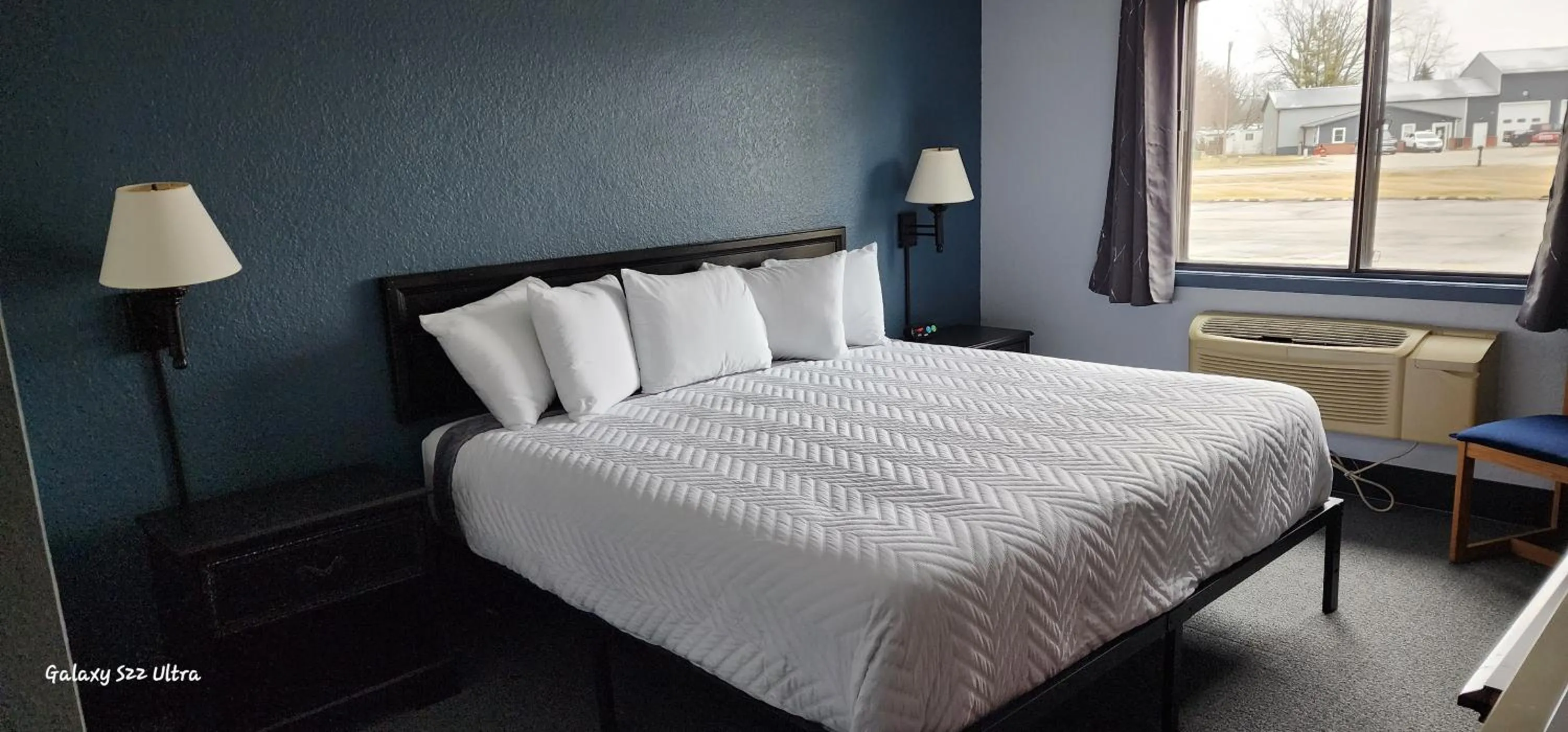 Bed in The Oasis Hotel & Bar