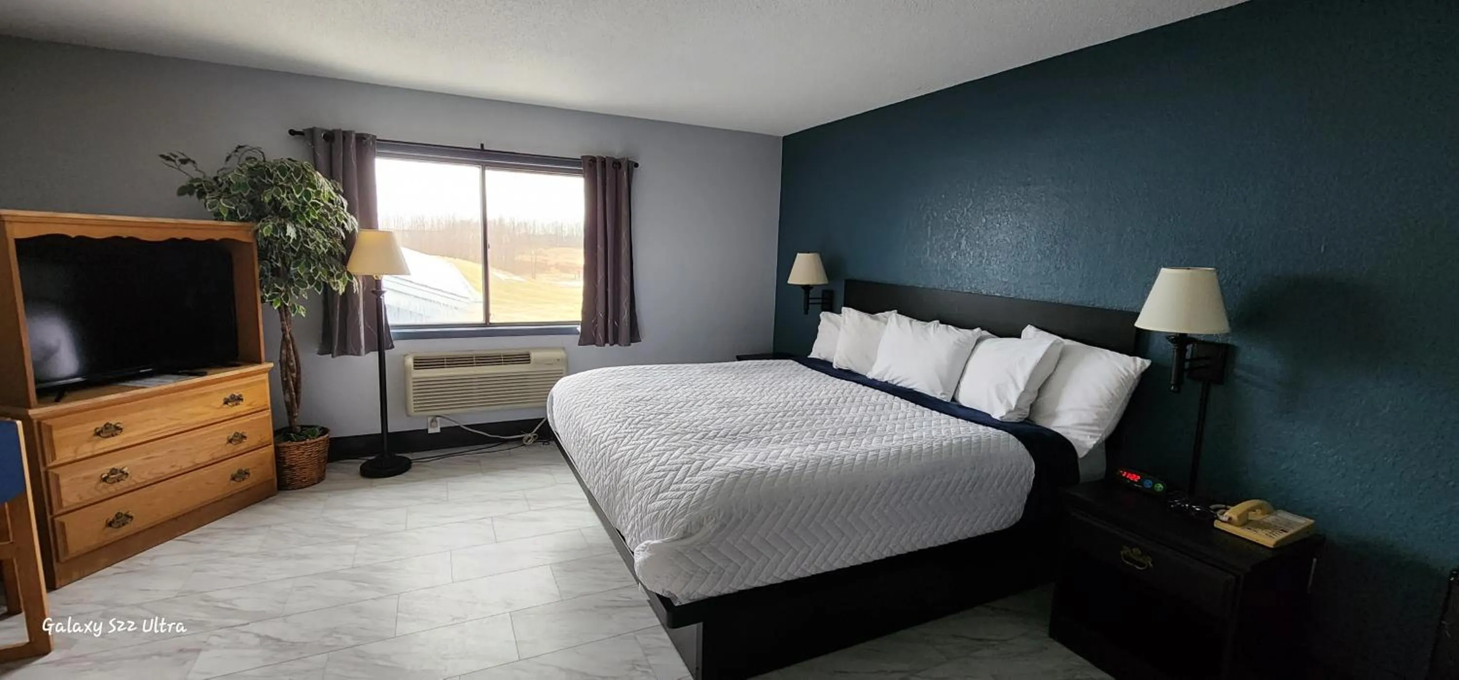 Bed in The Oasis Hotel & Bar