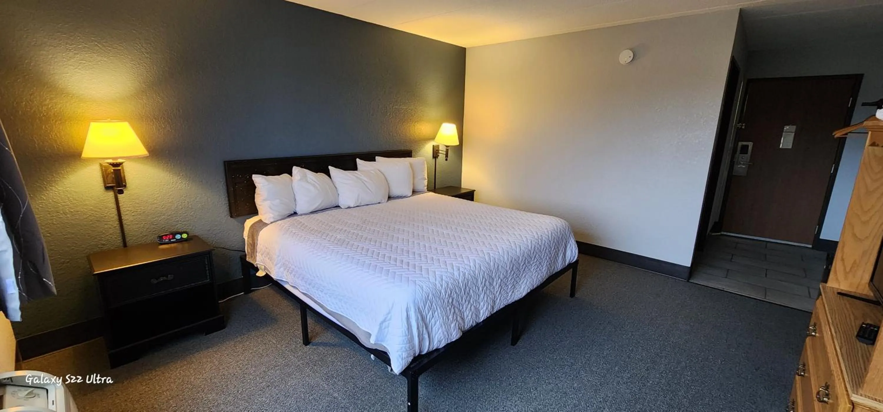 Bed in The Oasis Hotel & Bar