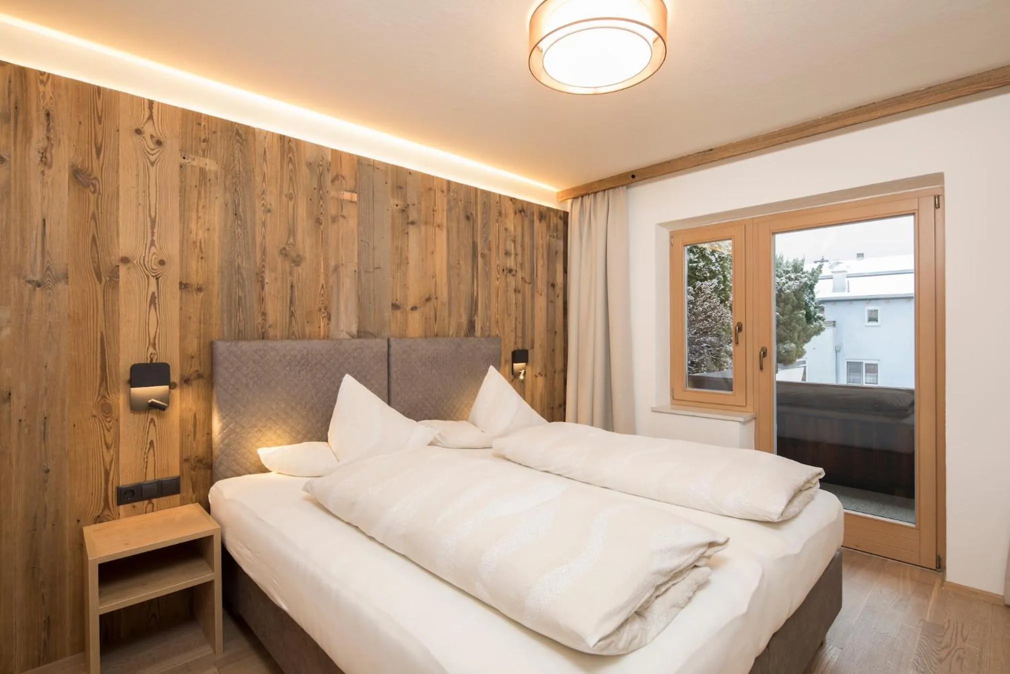 Bed in Angerer Alpine Suiten und Familienappartements Tirol