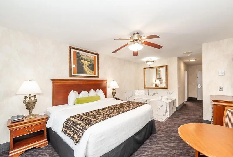 Bed in Bellissimo Hotel, Trademark by Wyndham Near Foxwoods Casino