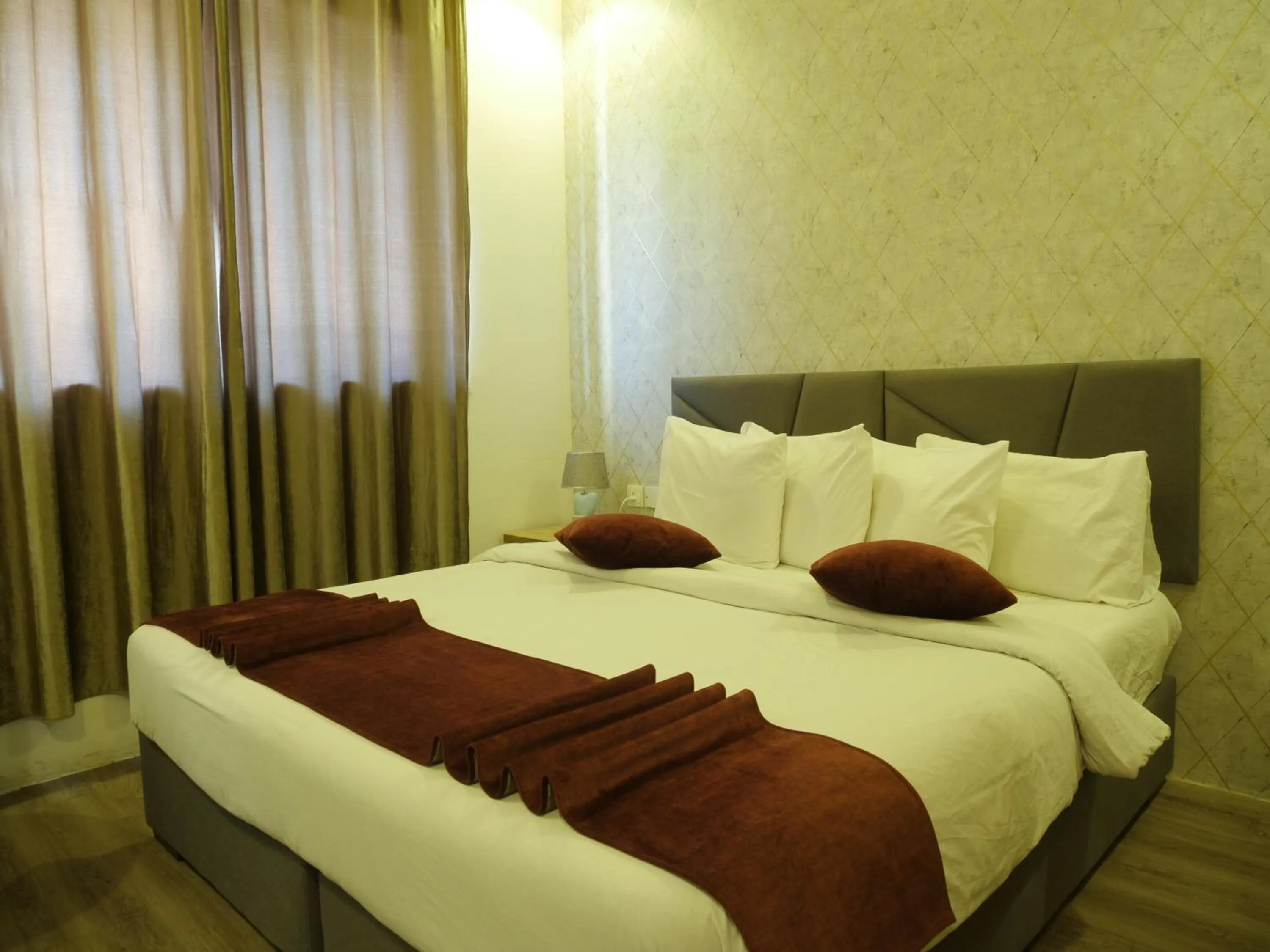 Bed in Twins Downtown Hotel