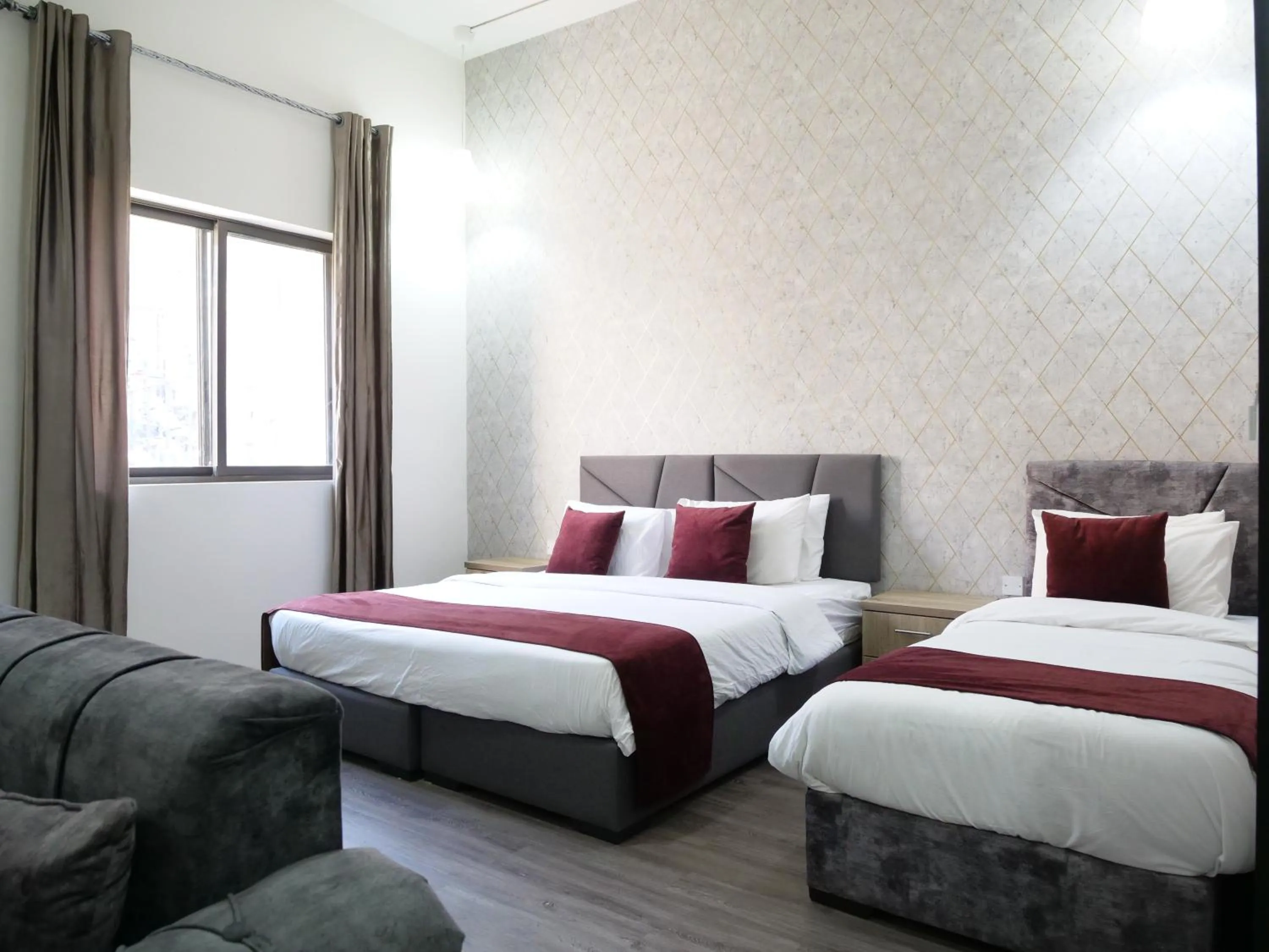 Bed in Twins Downtown Hotel