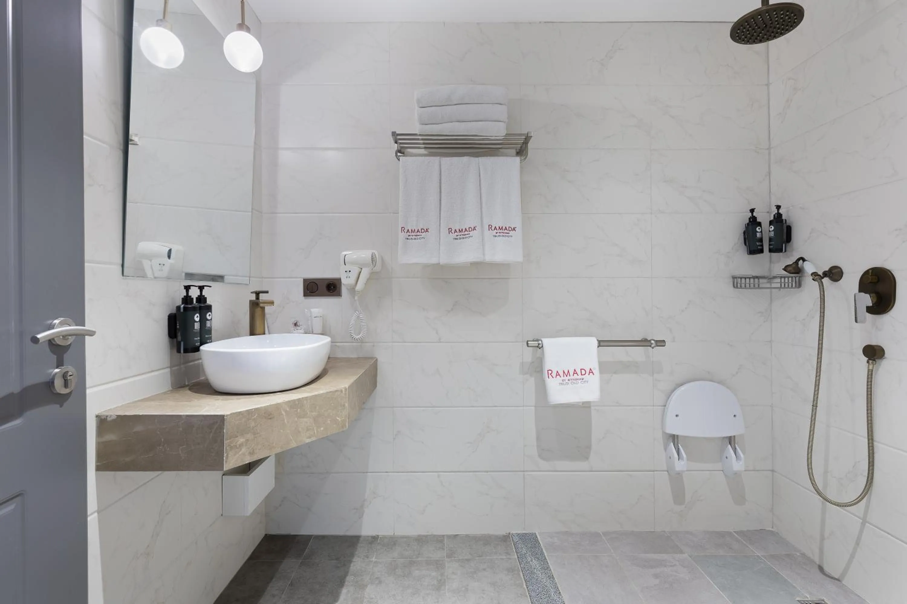 Shower in Ramada by Wyndham Tbilisi Old City
