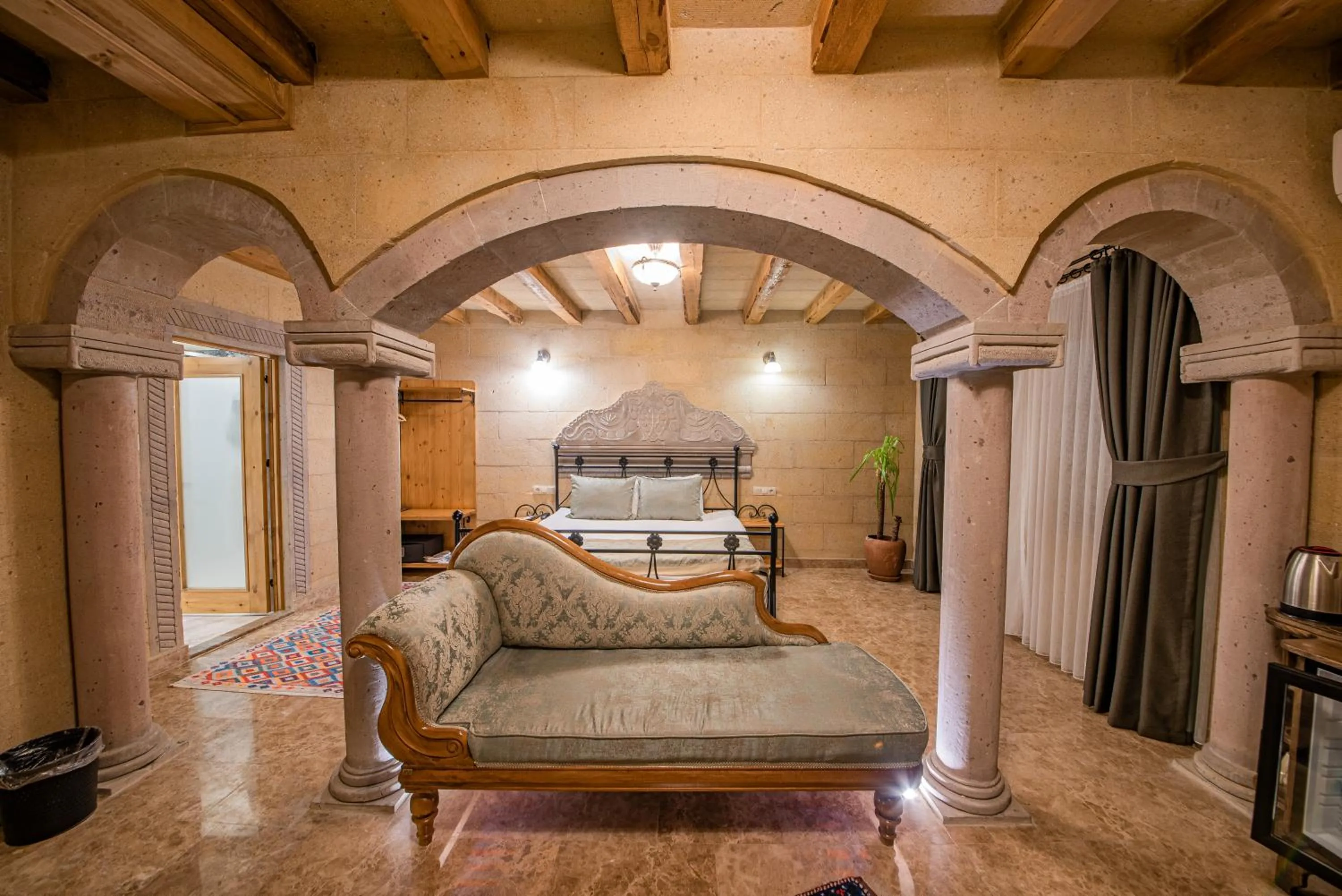 Seating area, Bed in Cratus Stone Palace