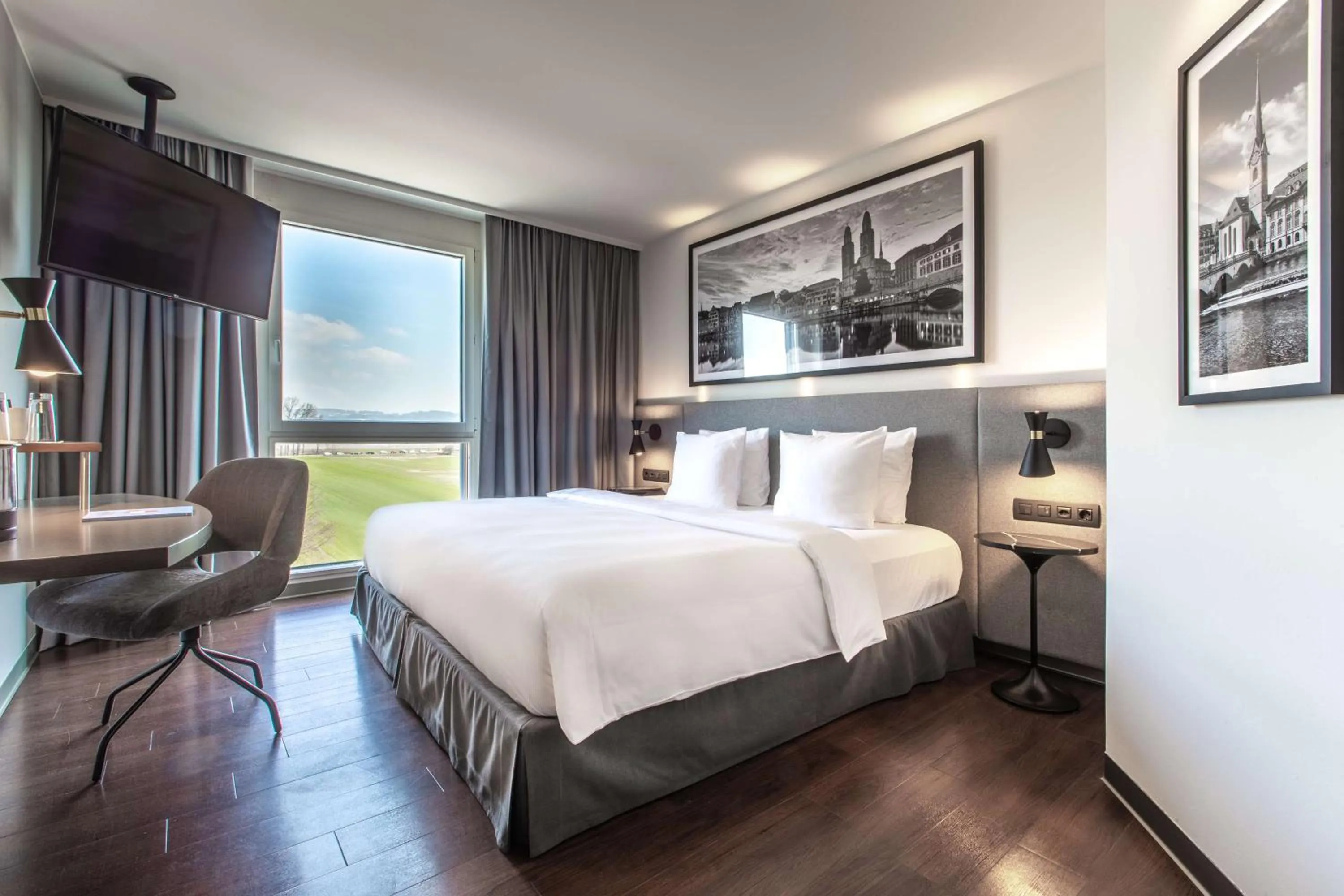 Photo of the whole room, Bed in Radisson Hotel Zurich Airport