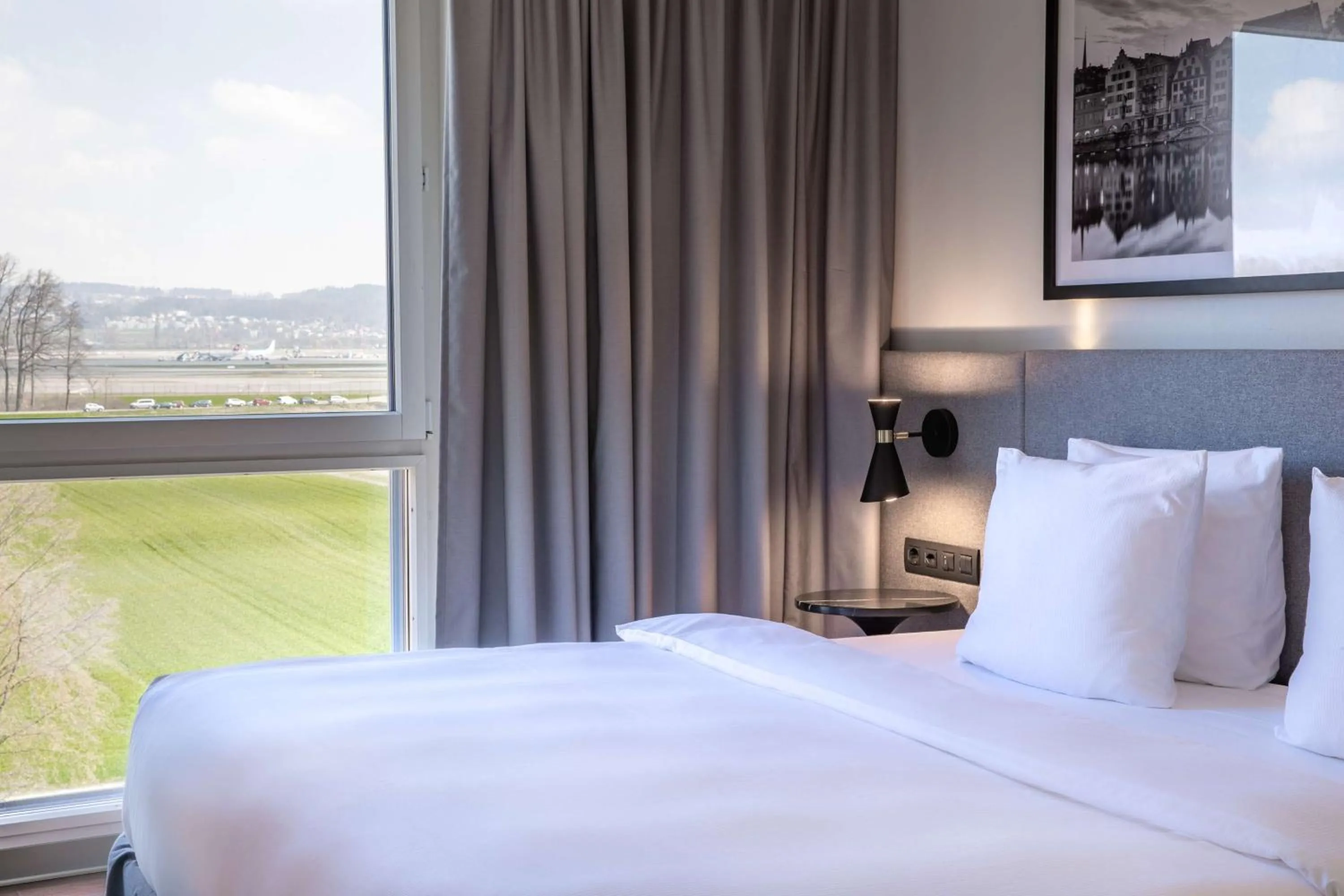 Photo of the whole room, Bed in Radisson Hotel Zurich Airport