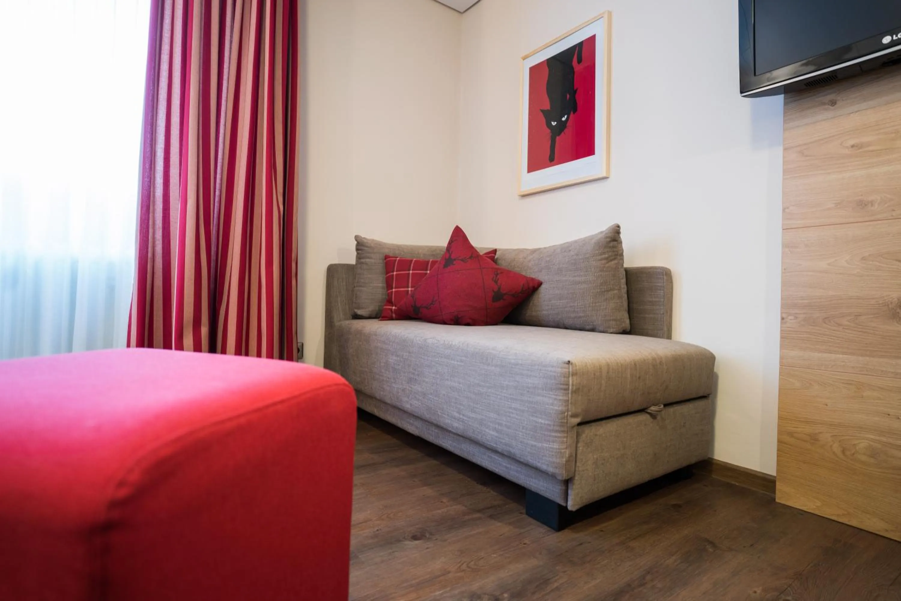 Seating area, Bed in Hotel Hirsch