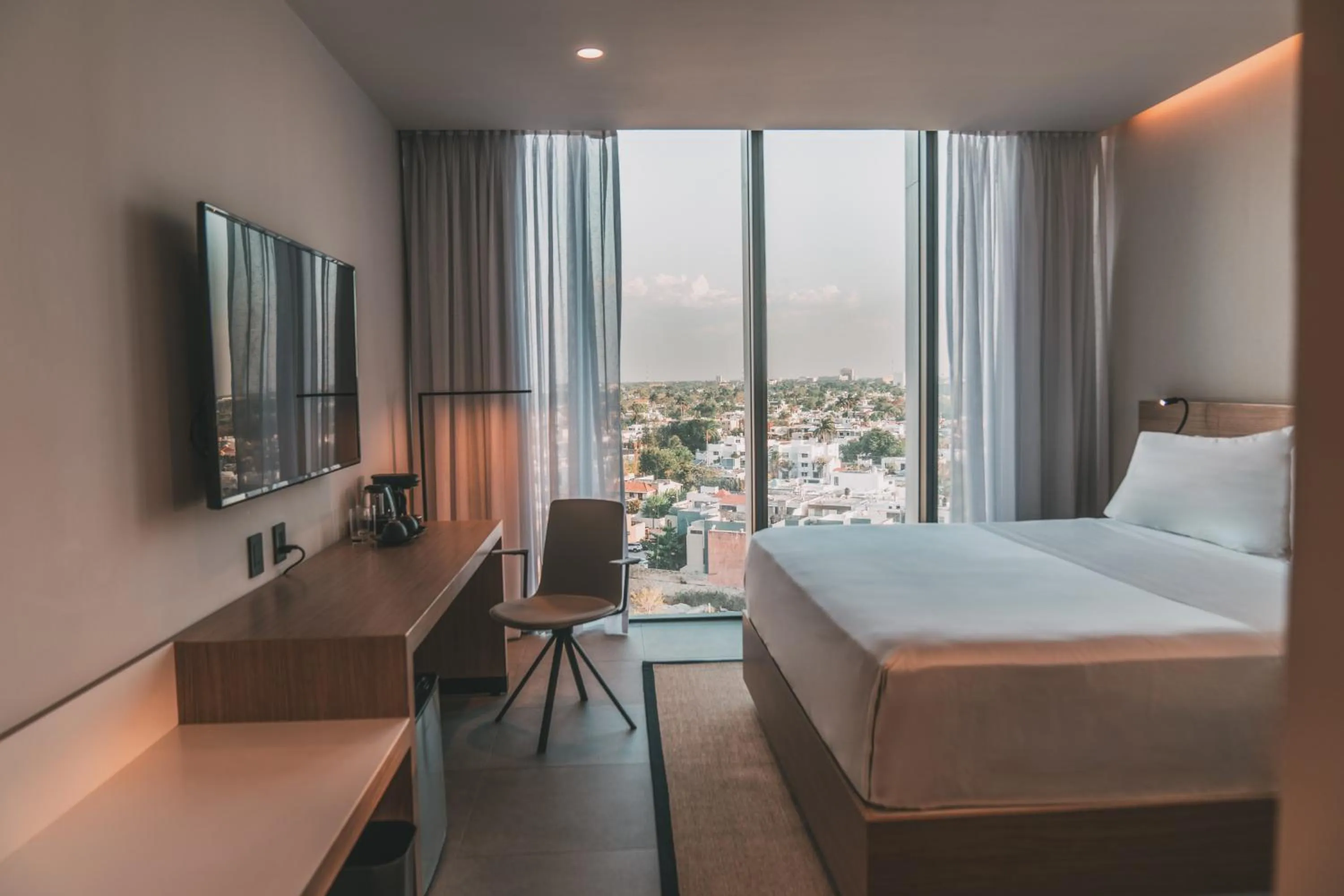 Communal lounge/ TV room, Bed in AKEN MIND Mérida Hotel