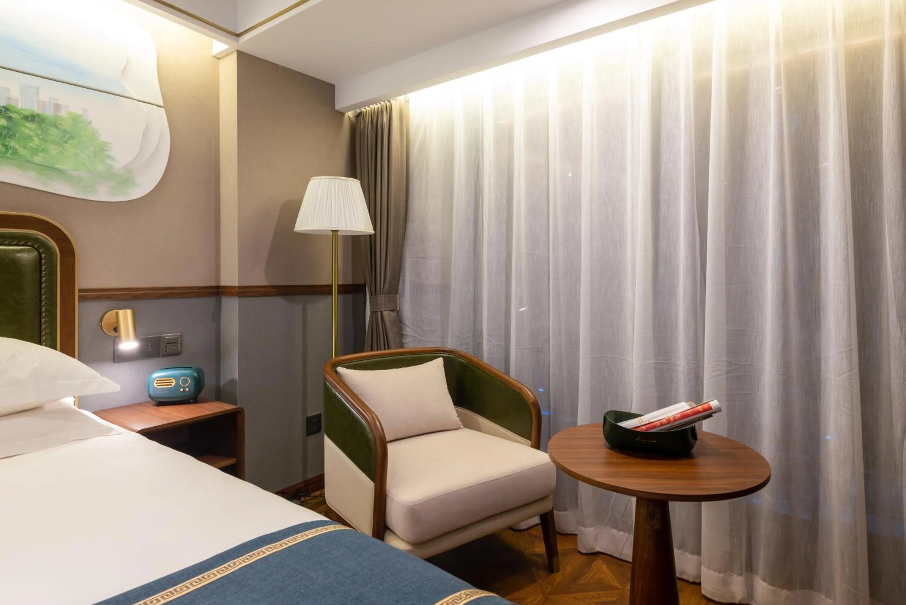 Seating area, Bed in Nost algia S Hotel Beijing Guomao CBD 时光漫步S酒店 北京大望路地铁站店 Free fresh ground coffee,Free laundry service