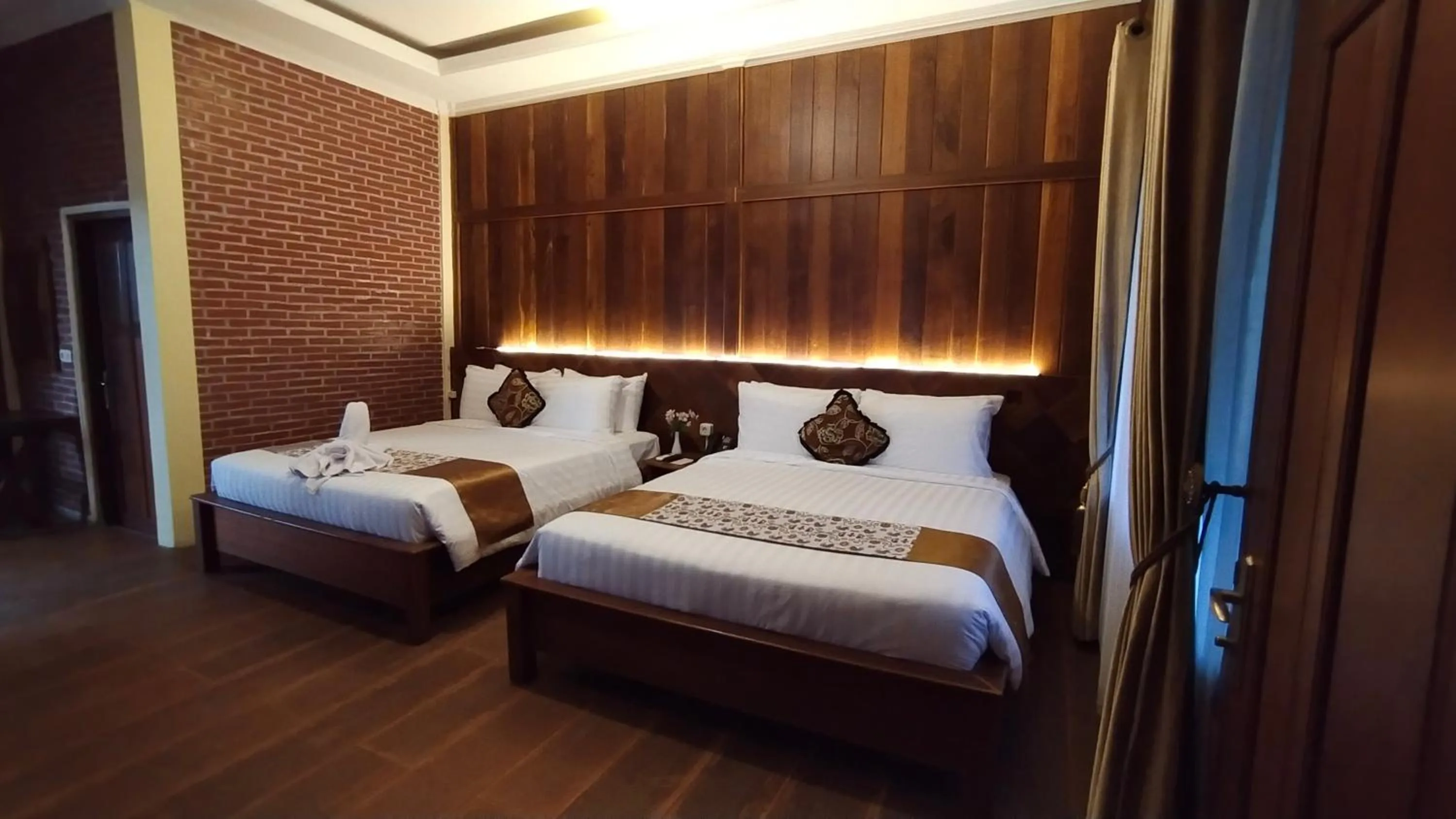 Bed in Kasuari Exotic Resort Magelang