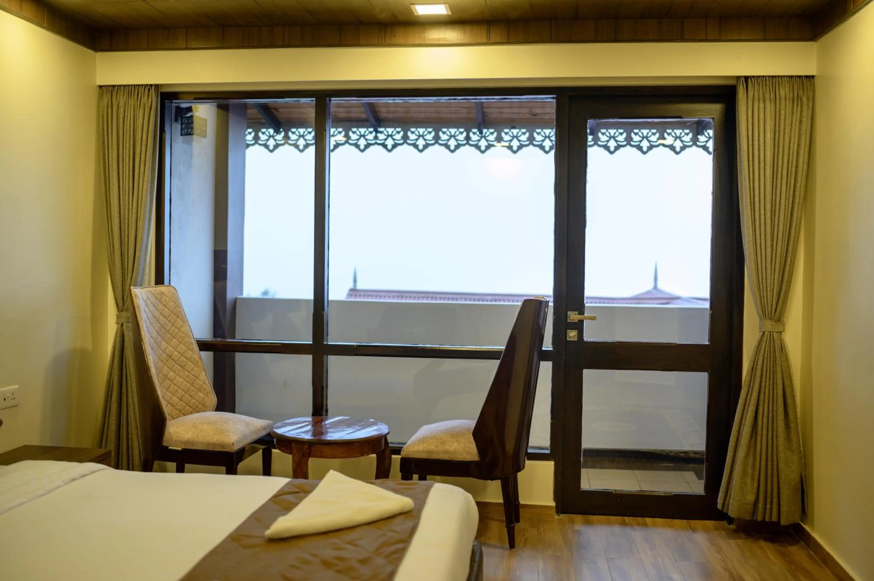 Living room, Bed in Istana Resort & Spa