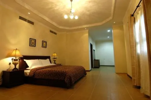 Bedroom in Ramee Suite Apartment 4