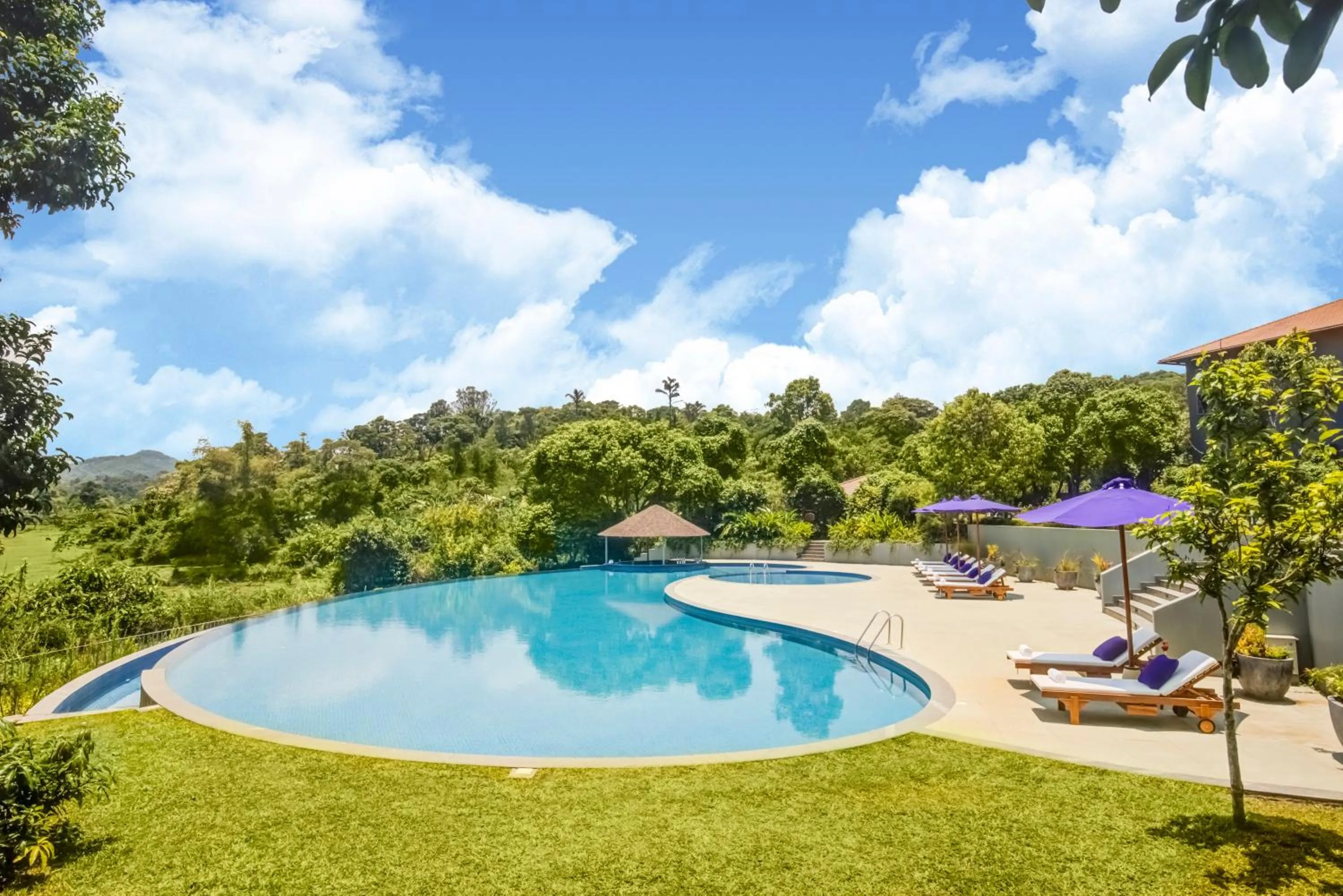 Swimming pool in Aurika, Coorg Luxury by Lemon Tree Hotels