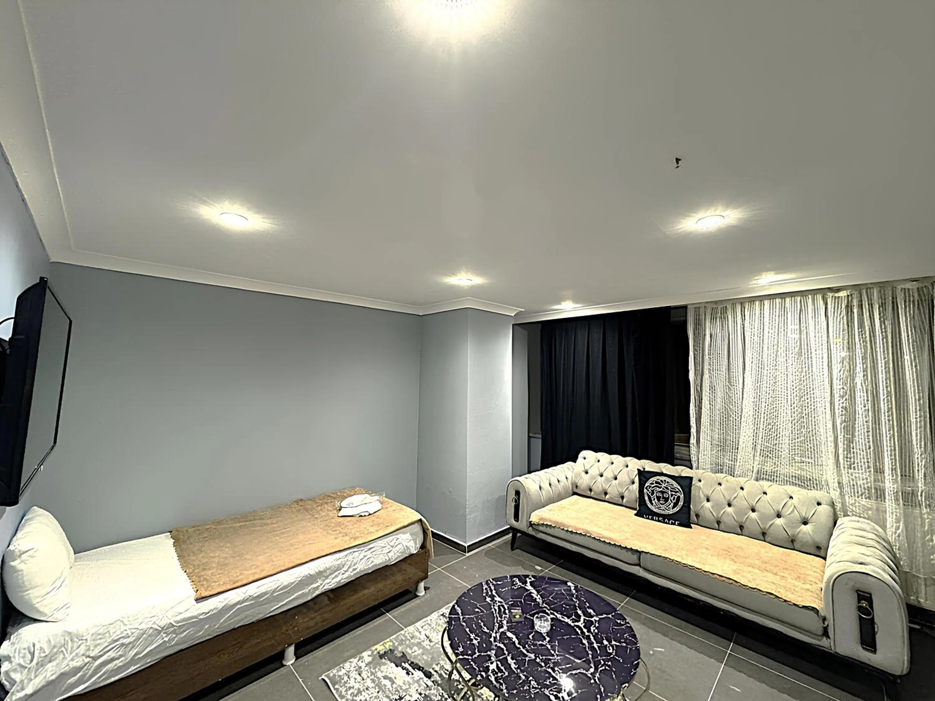 Bed in Grand Lara Hotel & Apartments