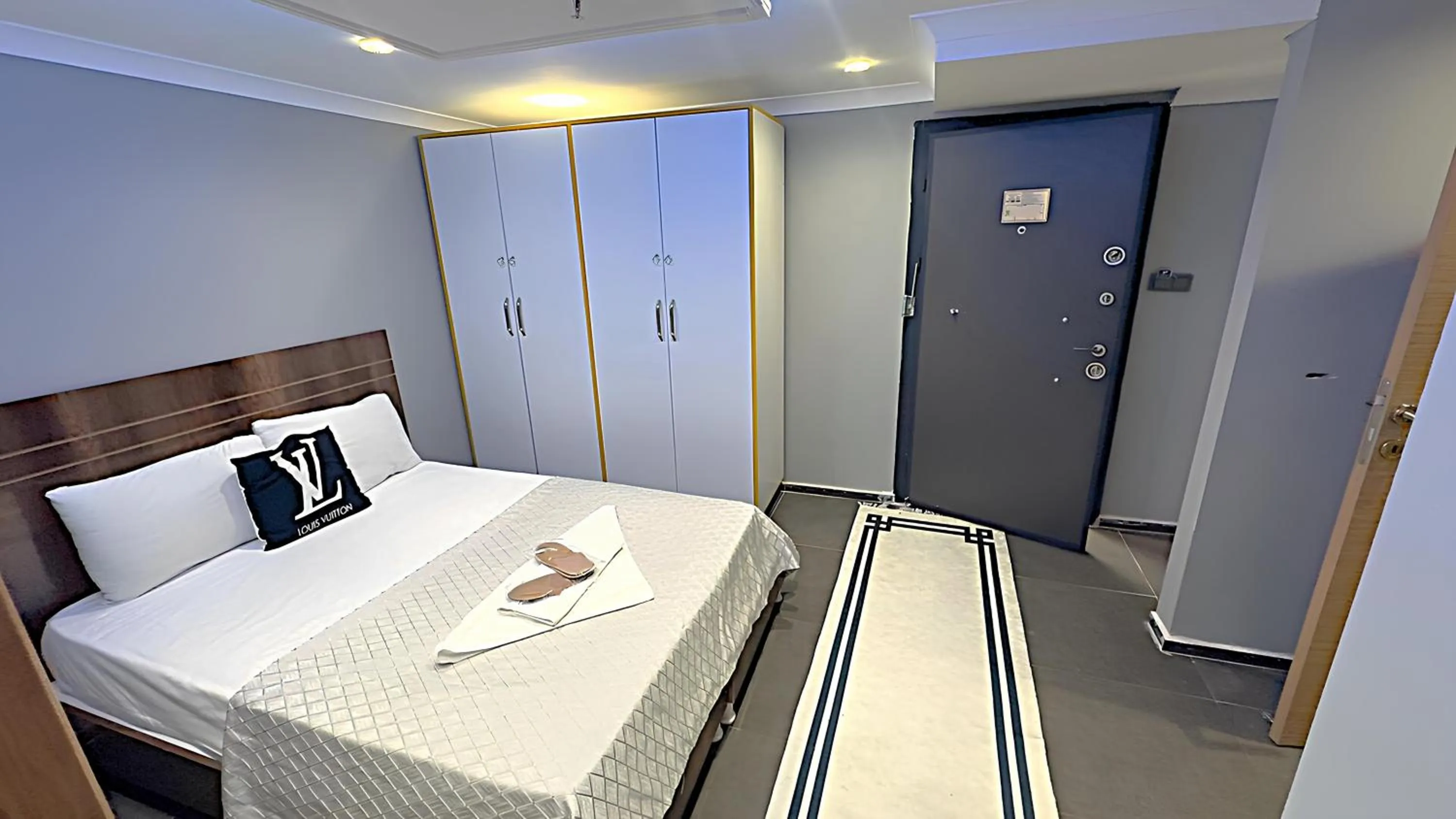 Bed in Grand Lara Hotel & Apartments