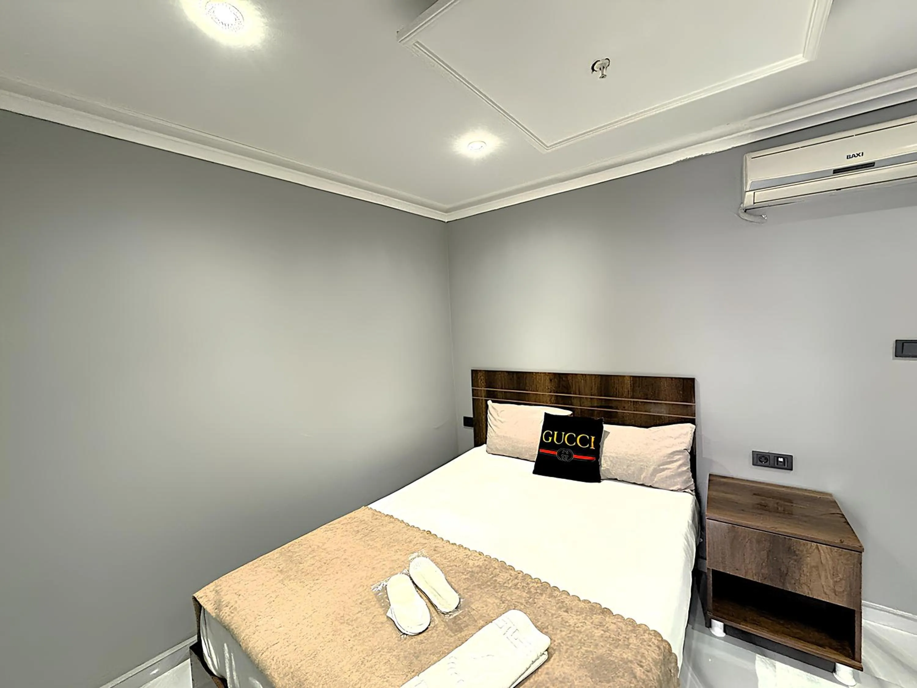 Bed in Grand Lara Hotel & Apartments