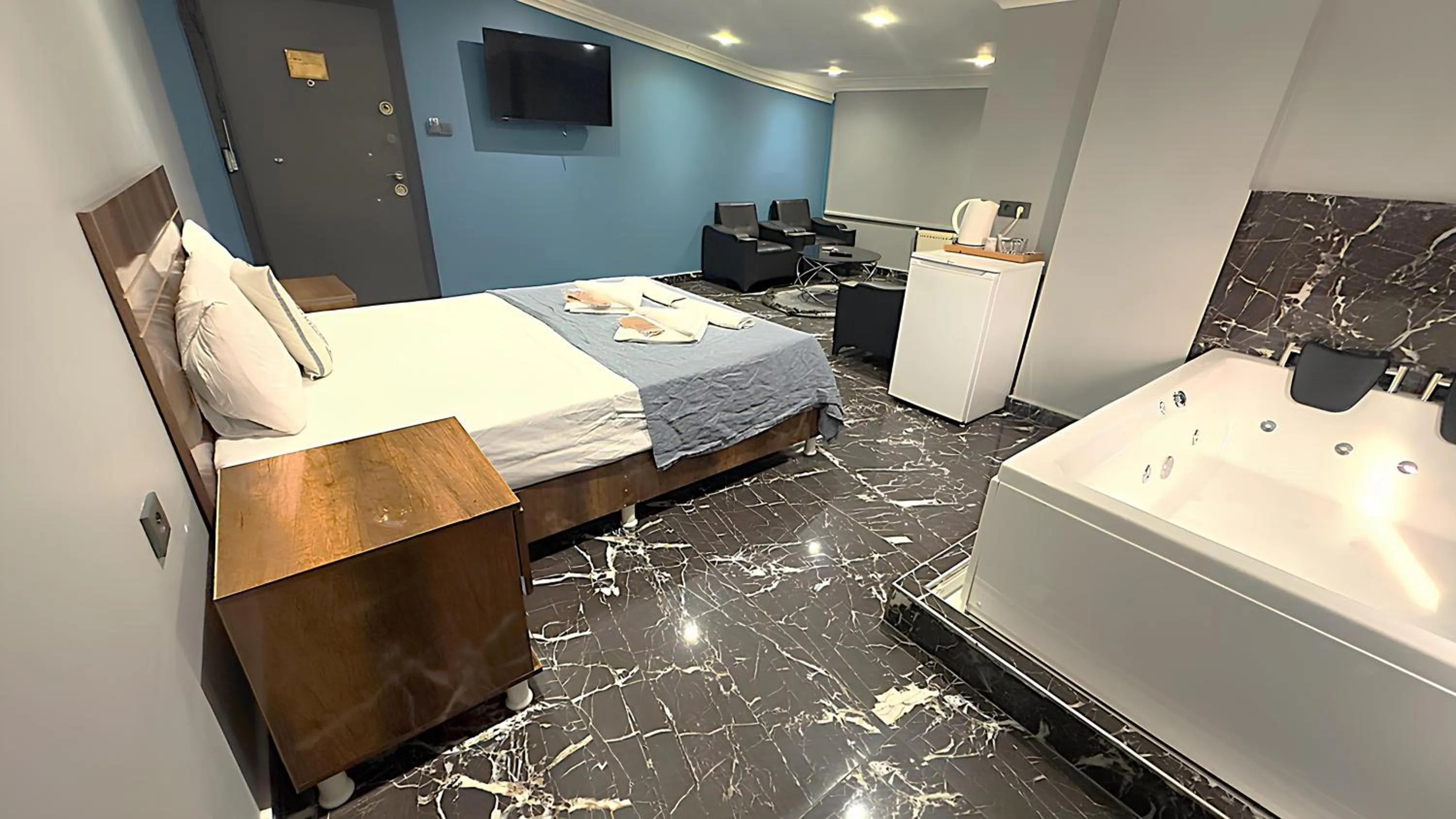 Bed in Grand Lara Hotel & Apartments