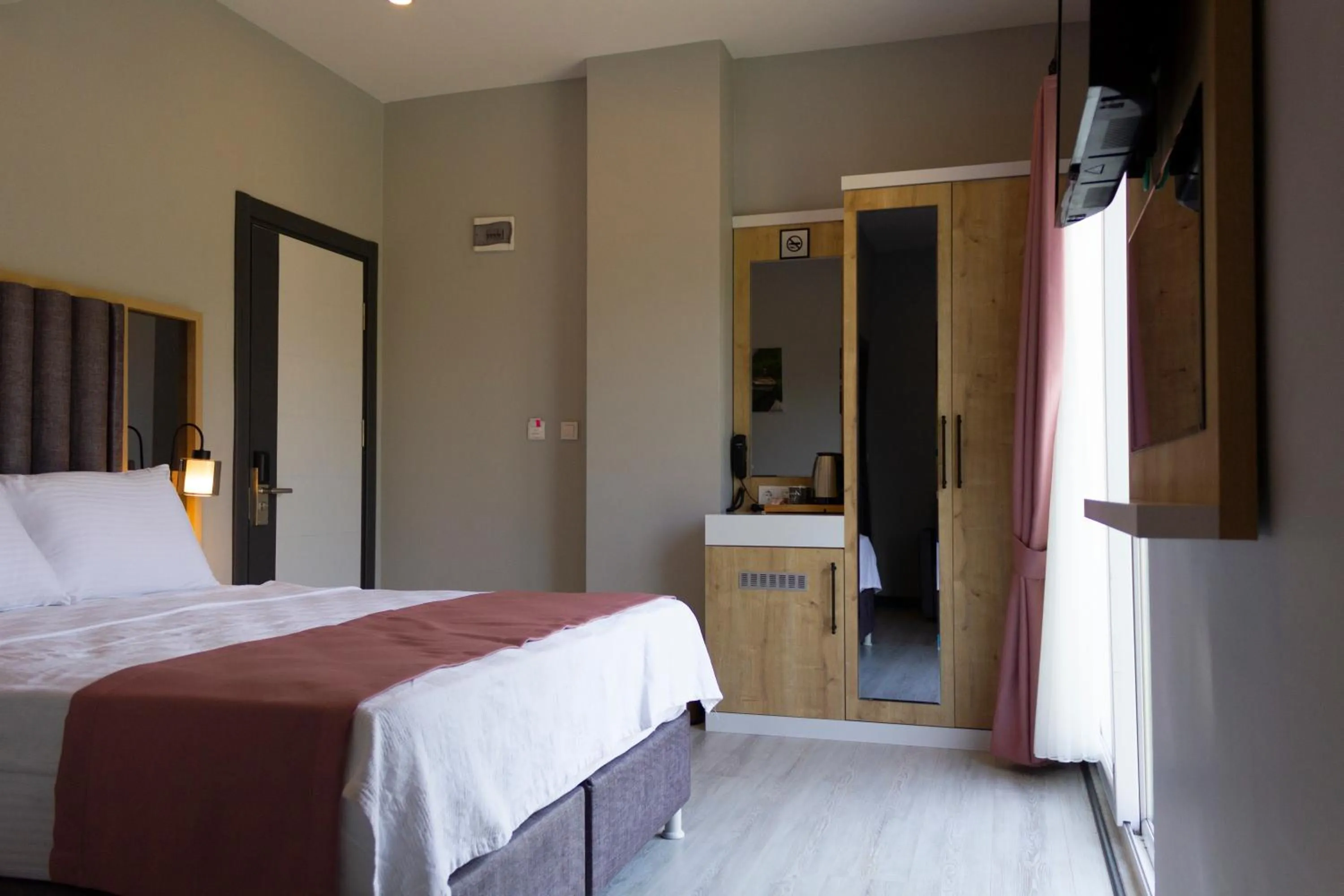 Bed in L'opera Deluxe Hotel