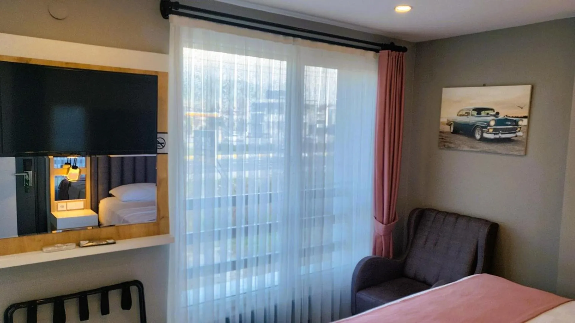 Seating area, Bed in L'opera Deluxe Hotel