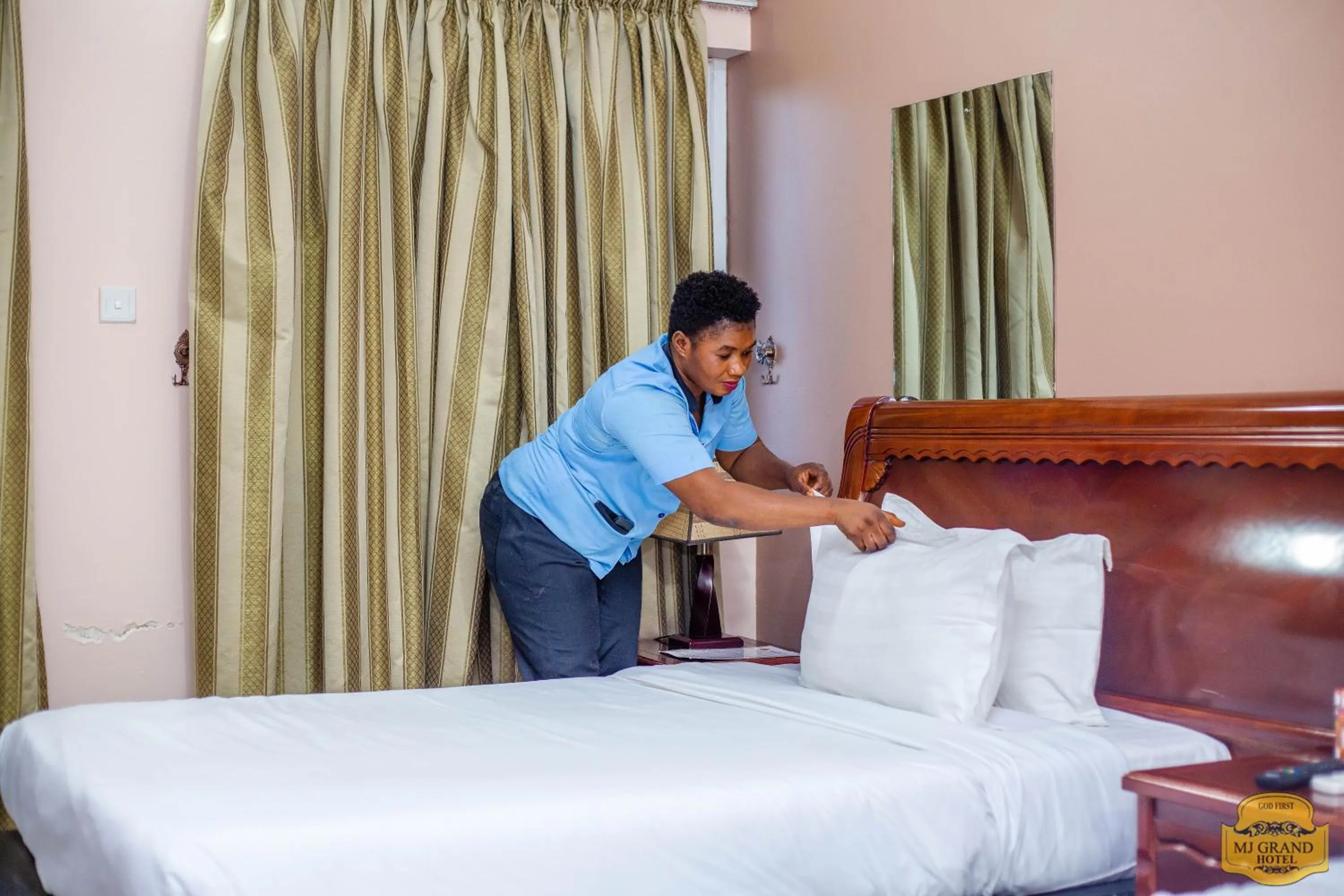 Bed in MJ Grand Hotel