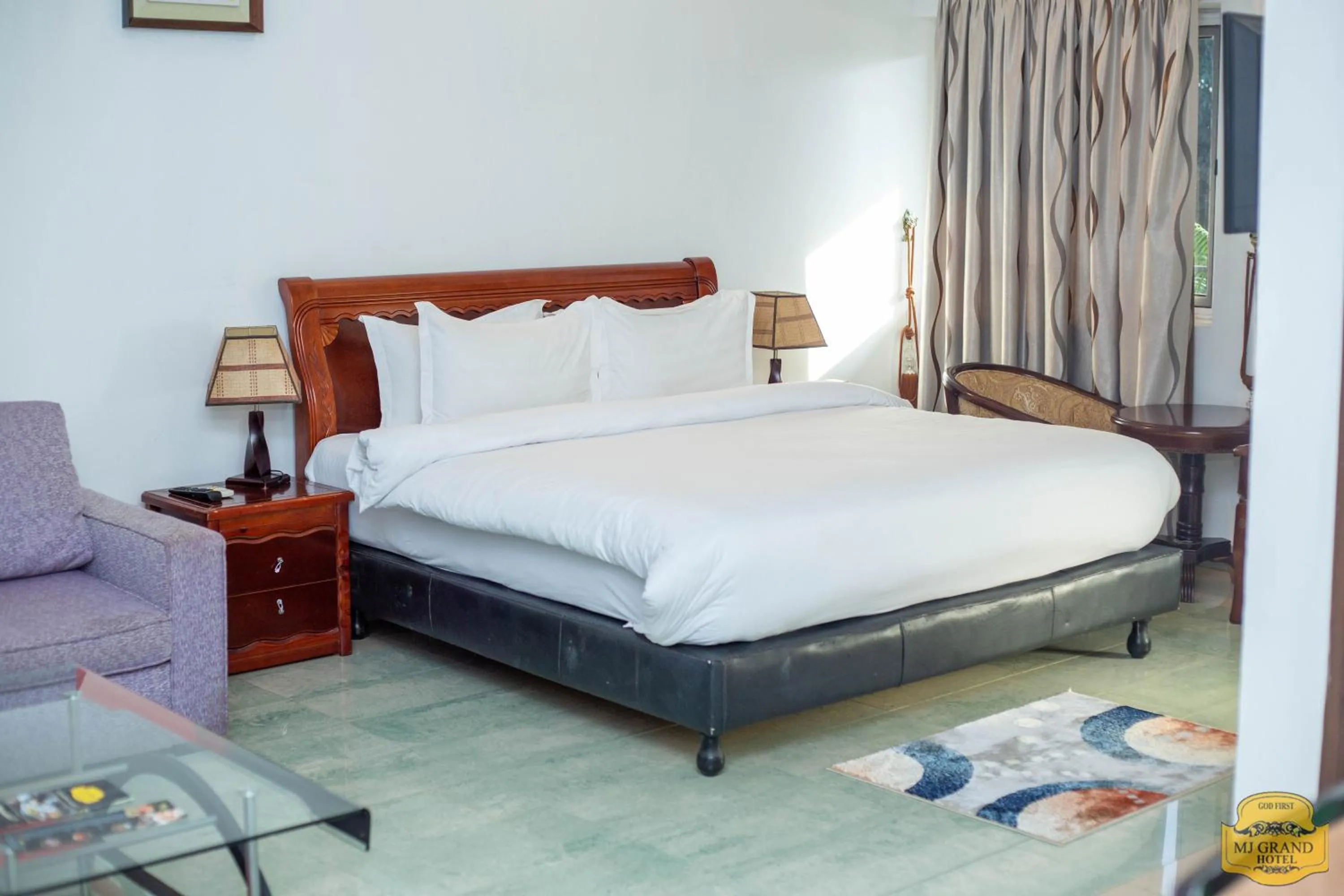 Bed in MJ Grand Hotel