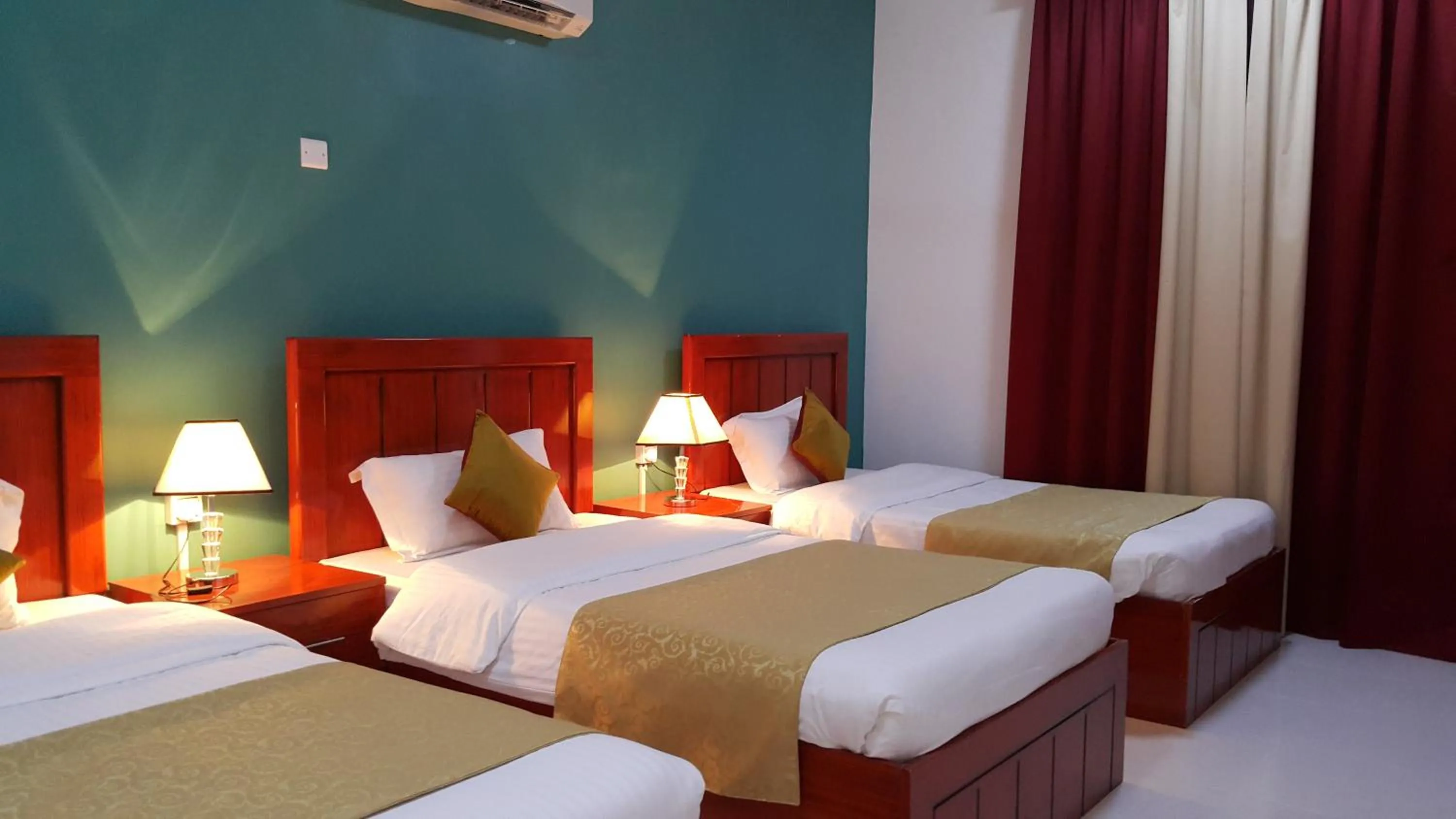 Bed in Al Karam Hotel Apartment