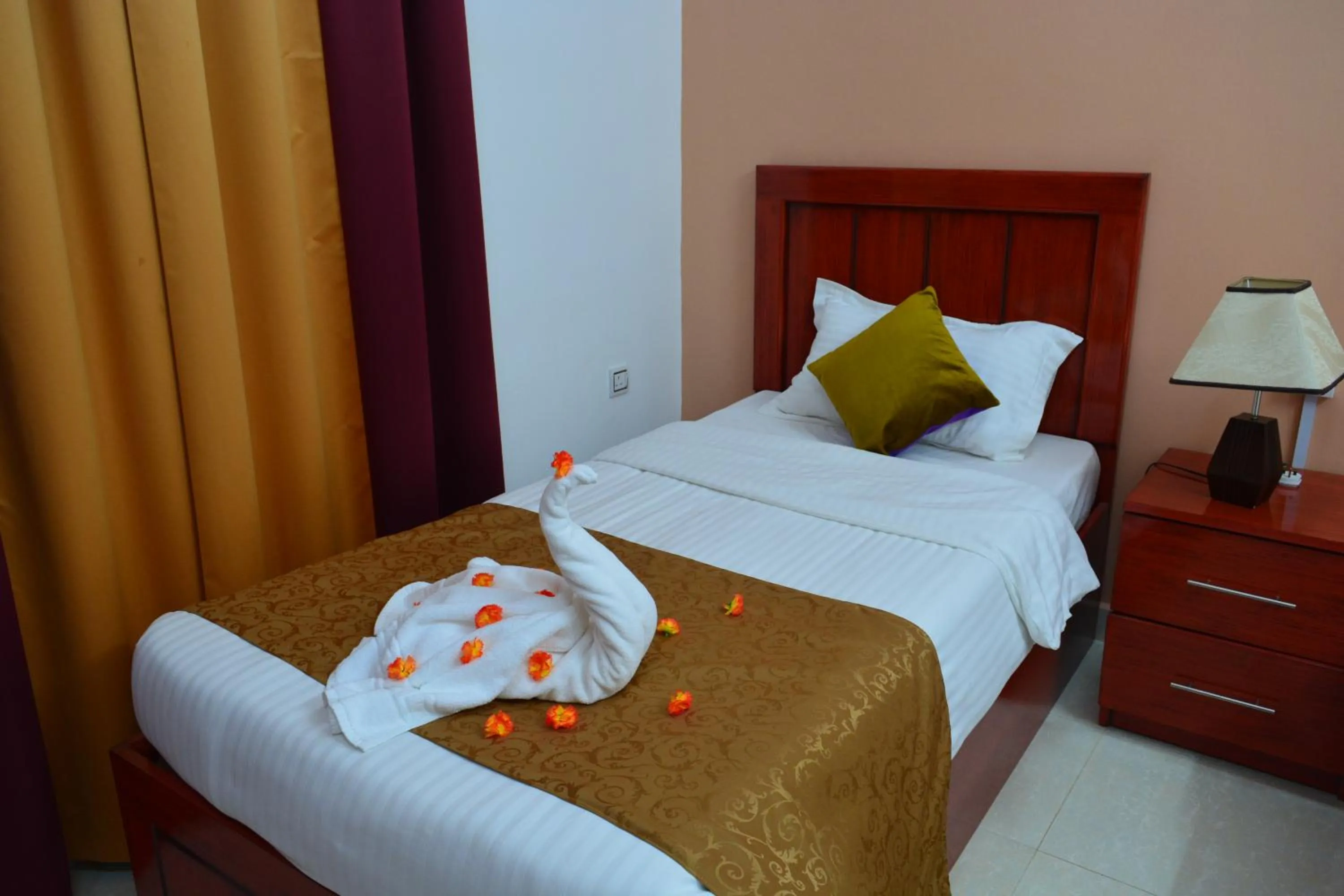 Bed in Al Karam Hotel Apartment