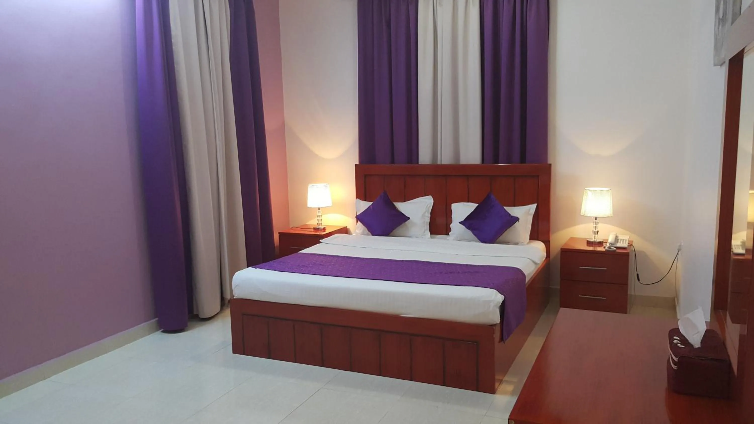 Bed in Al Karam Hotel Apartment