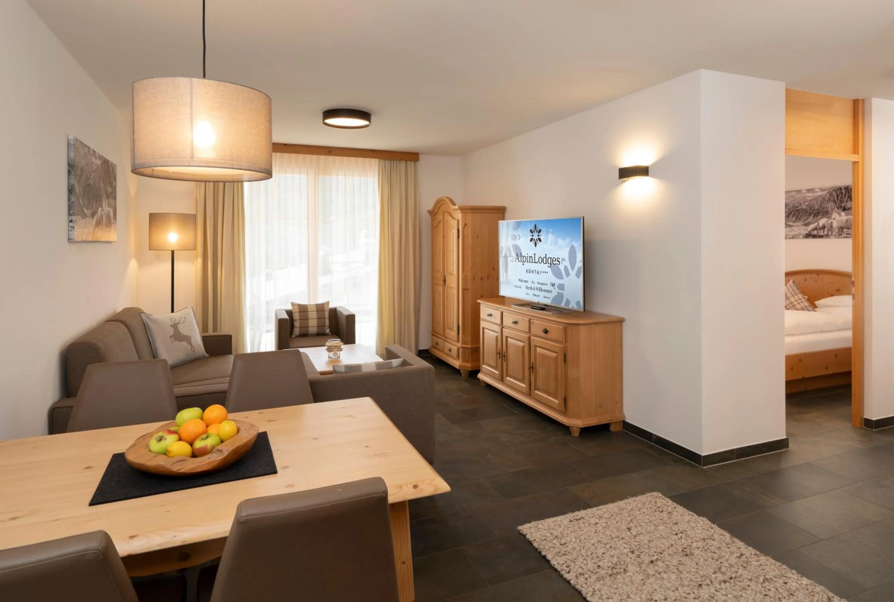 Living room, Bed in AlpinLodges Kühtai