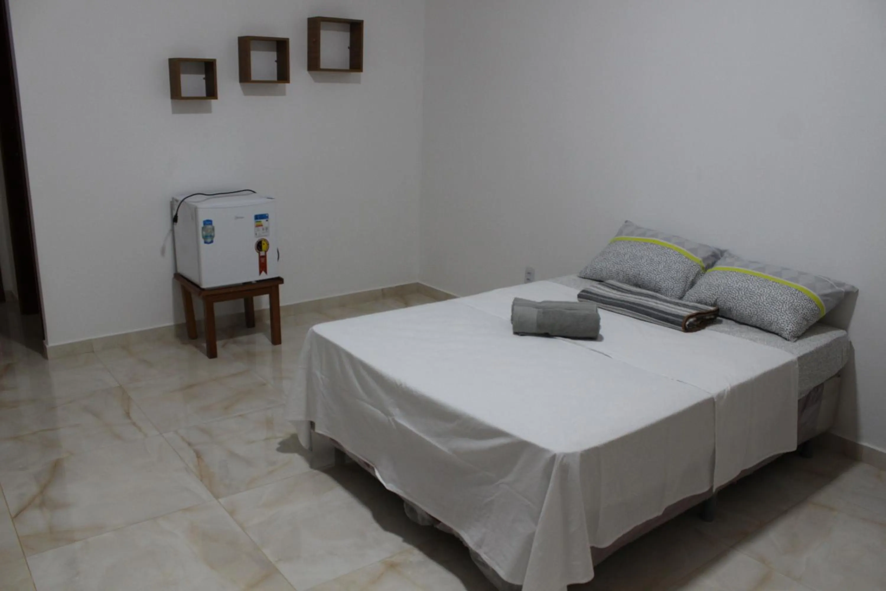 Bed in Hotel Jardim Tropical