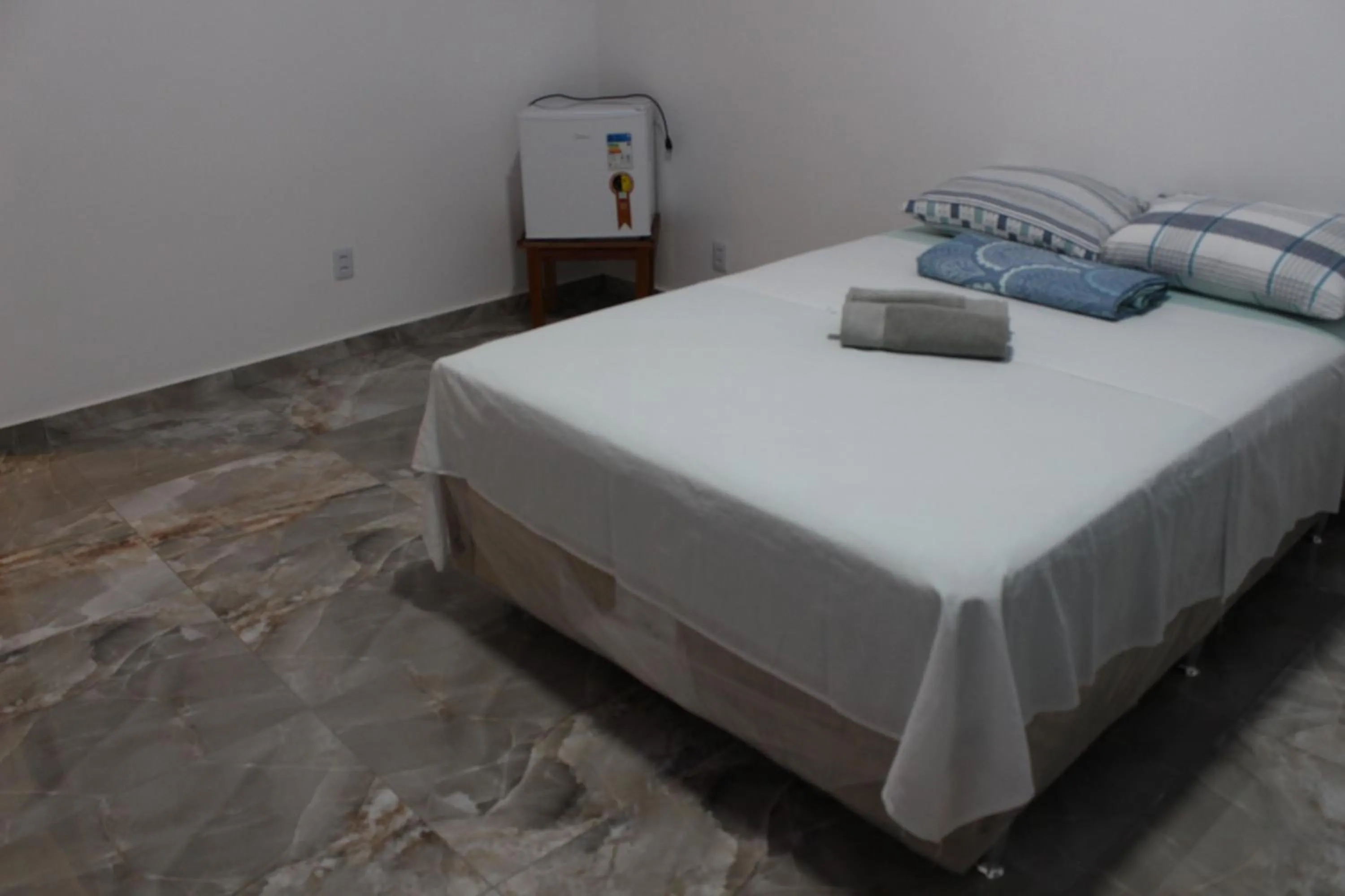 Bed in Hotel Jardim Tropical