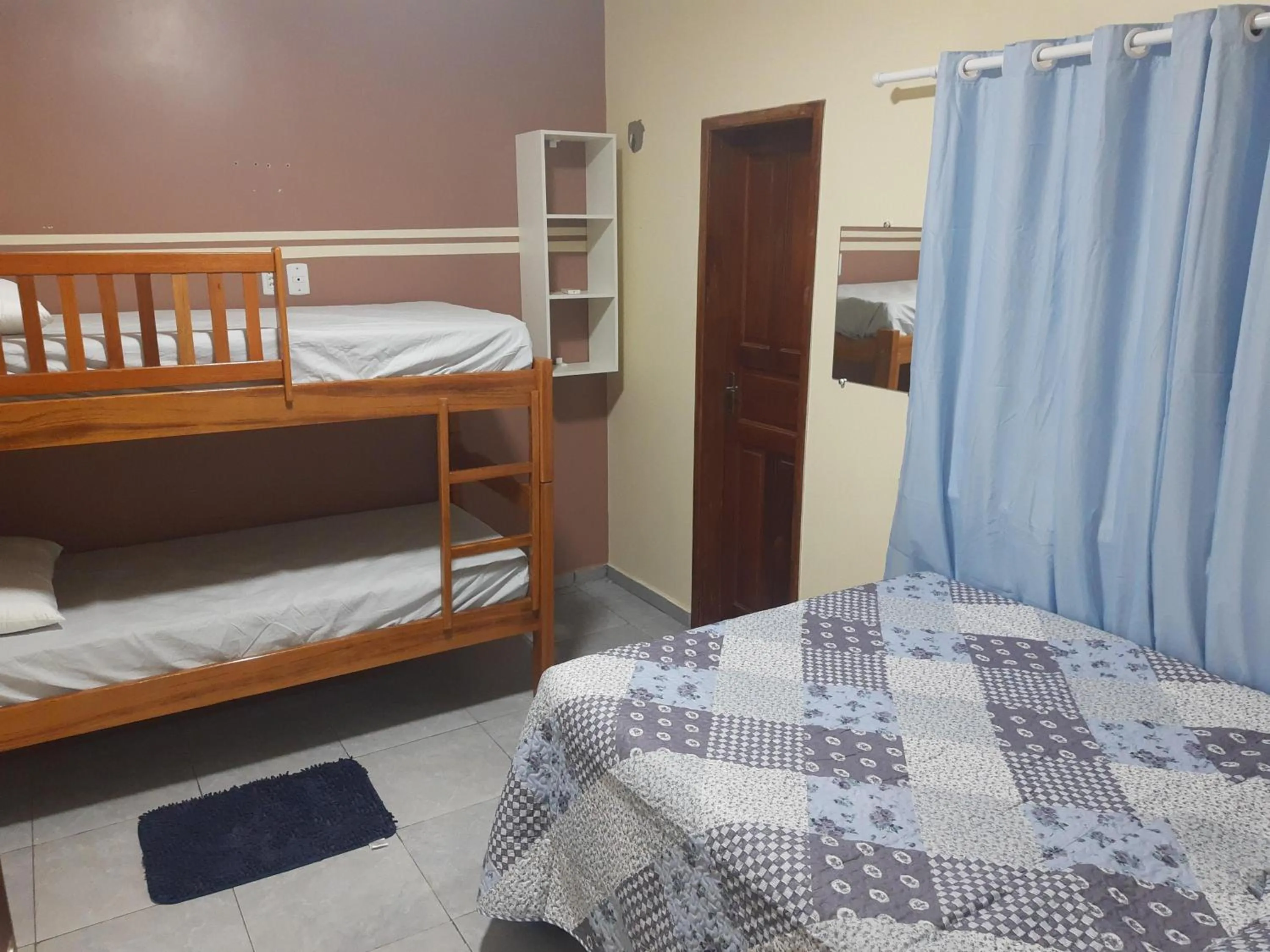 Bed in Hotel Jardim Tropical