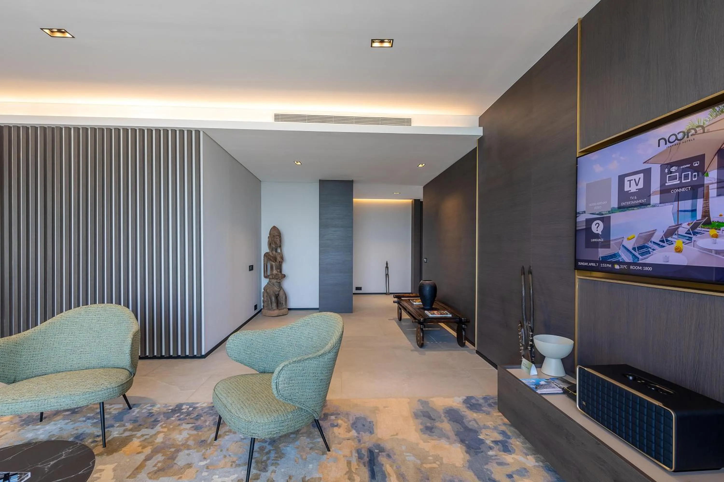 Communal lounge/ TV room in Noom Hotel Abidjan Plateau