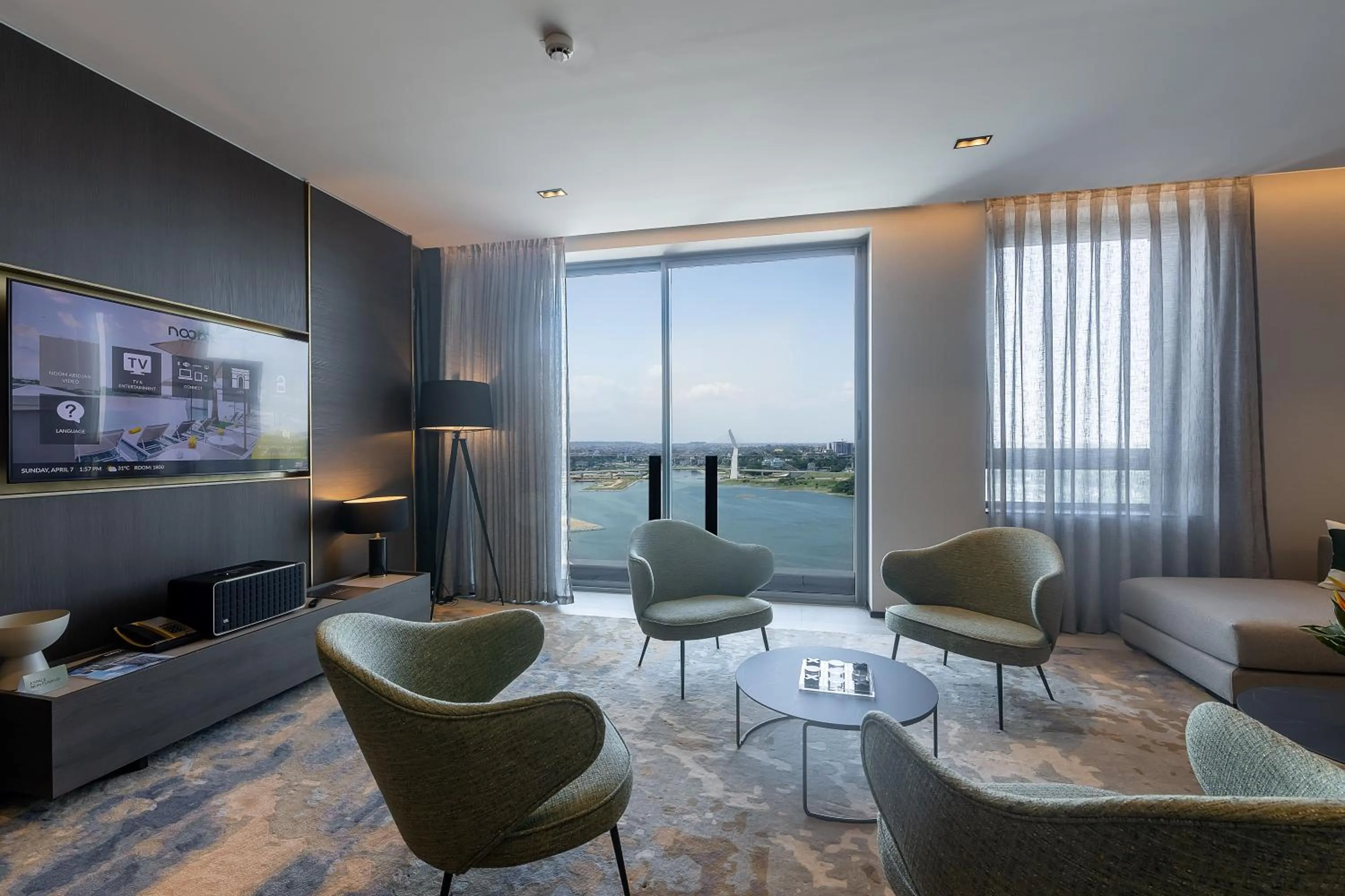 Communal lounge/ TV room in Noom Hotel Abidjan Plateau