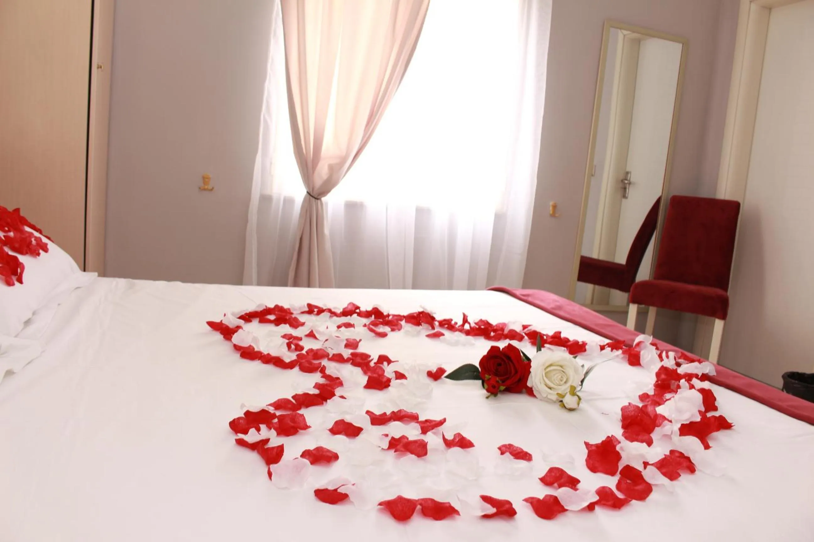 Bed in Theranda Boutique Hotel