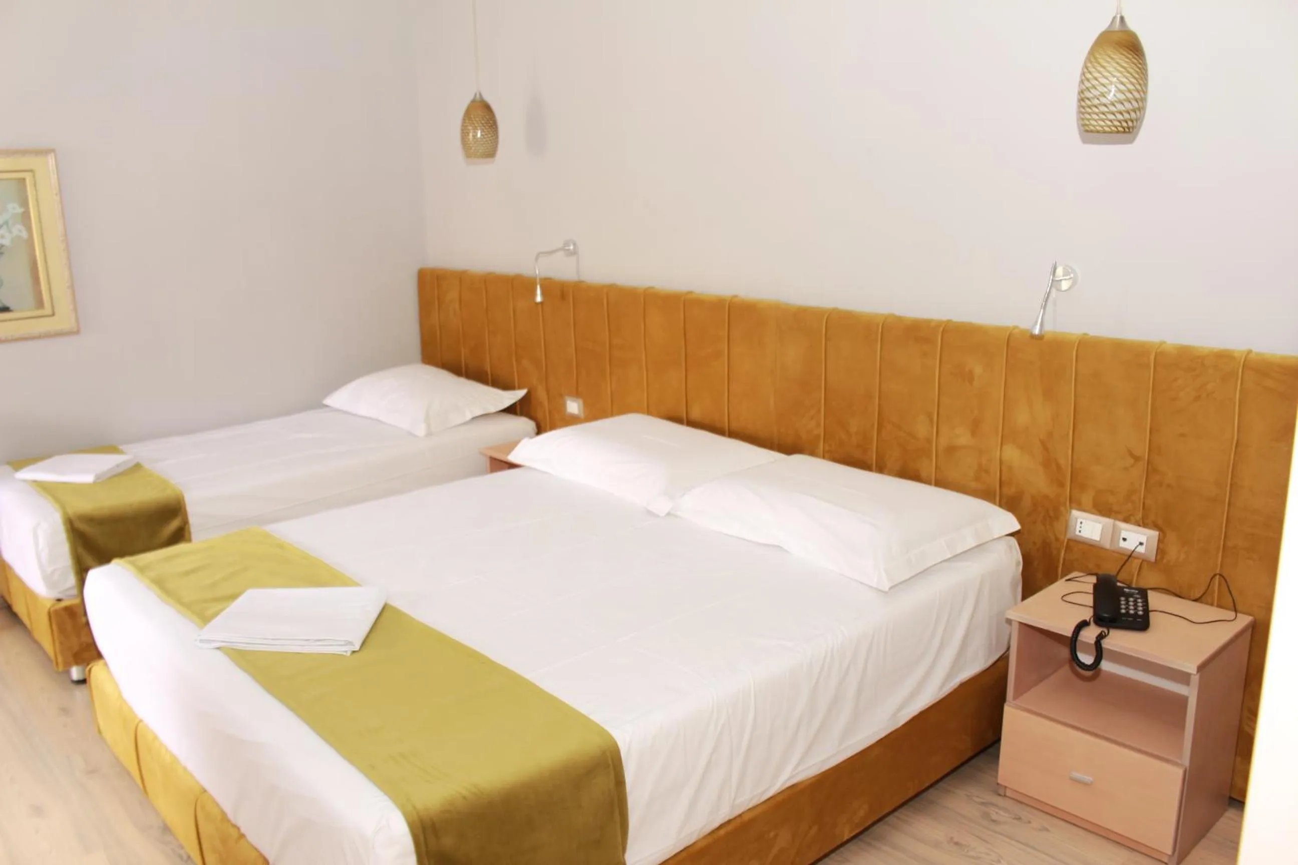 Bed in Theranda Boutique Hotel