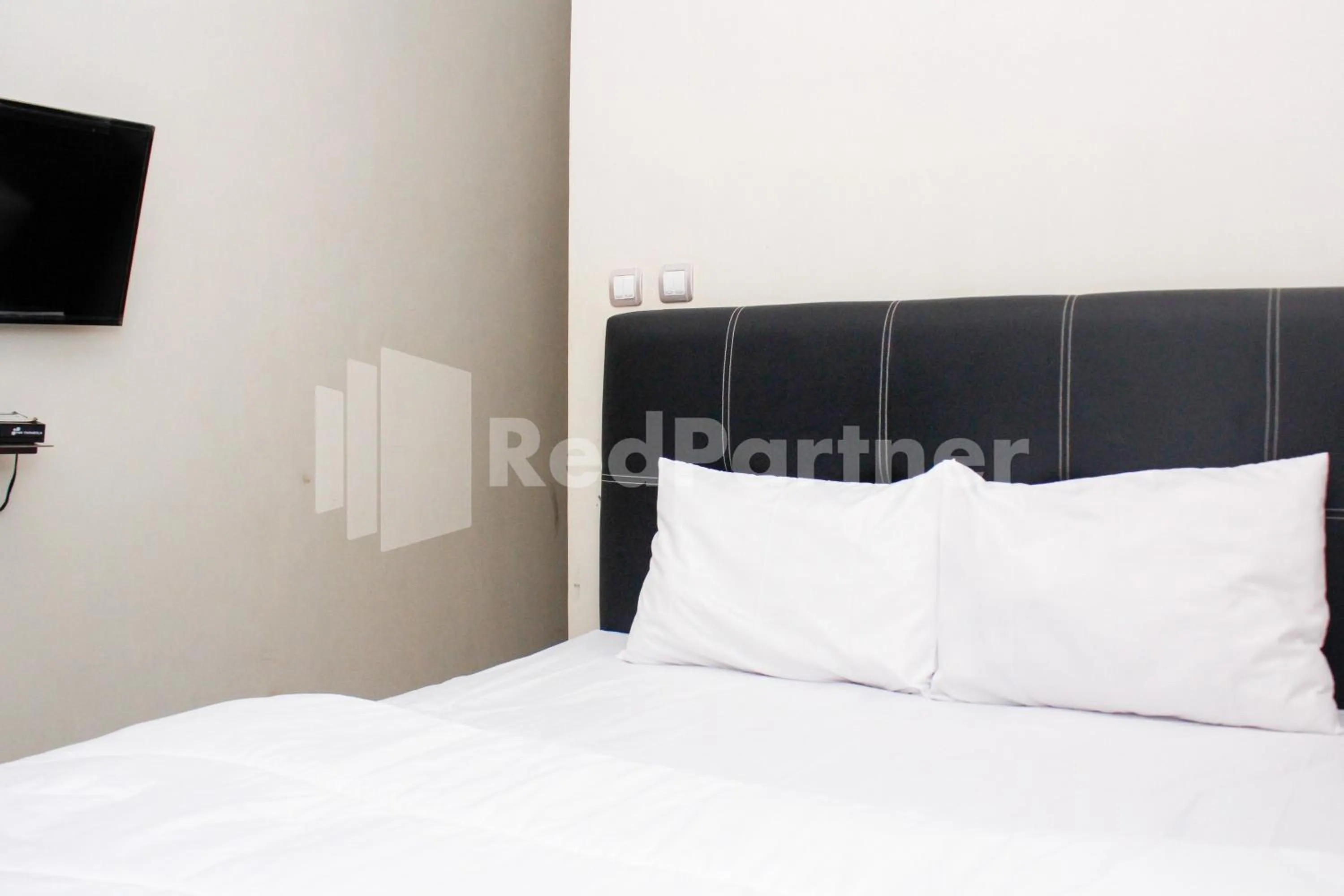 Bed in Hotel Baby Angel Dieng Mitra RedDoorz