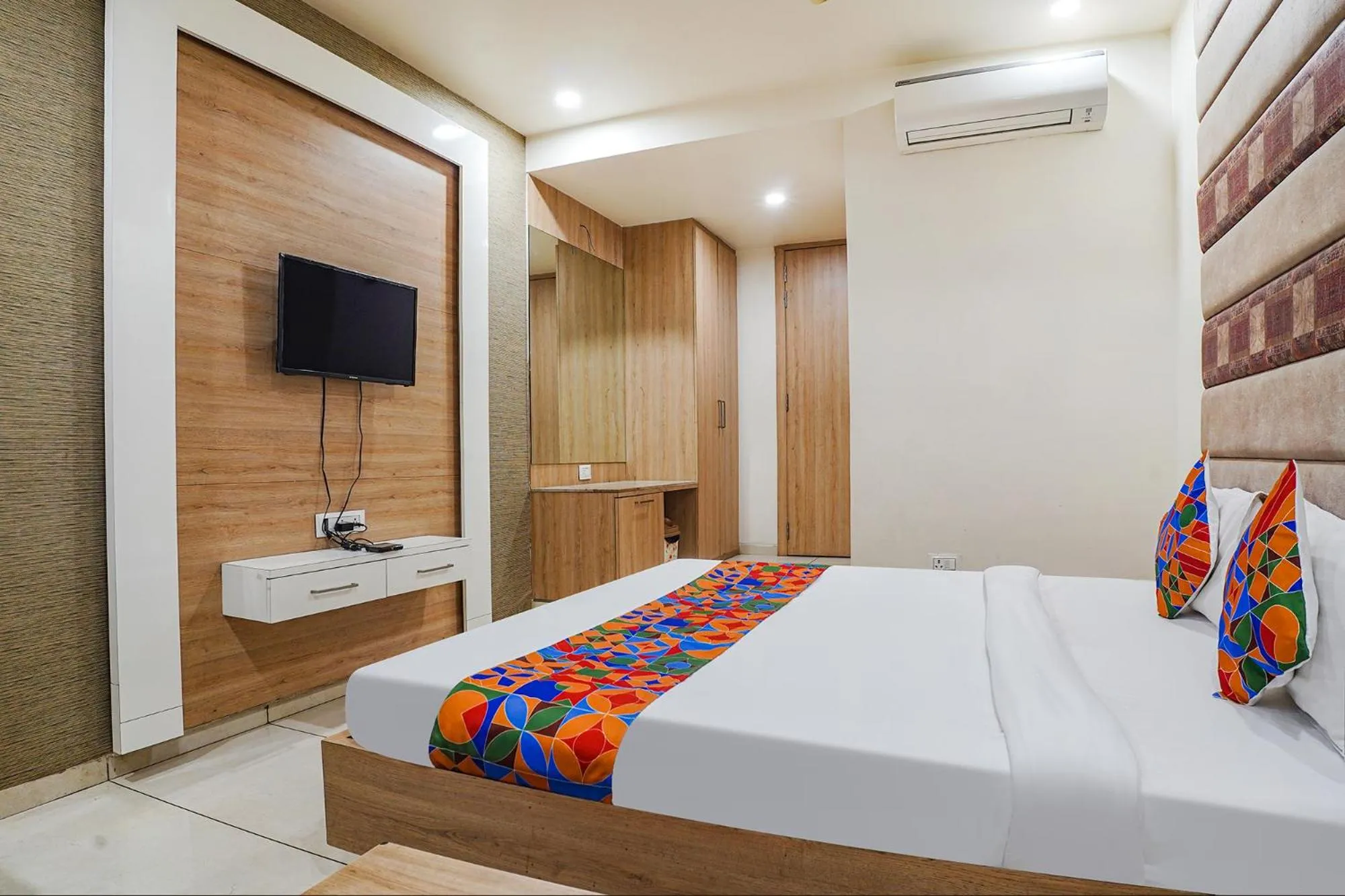 Bed in FabHotel Prime OM Palace