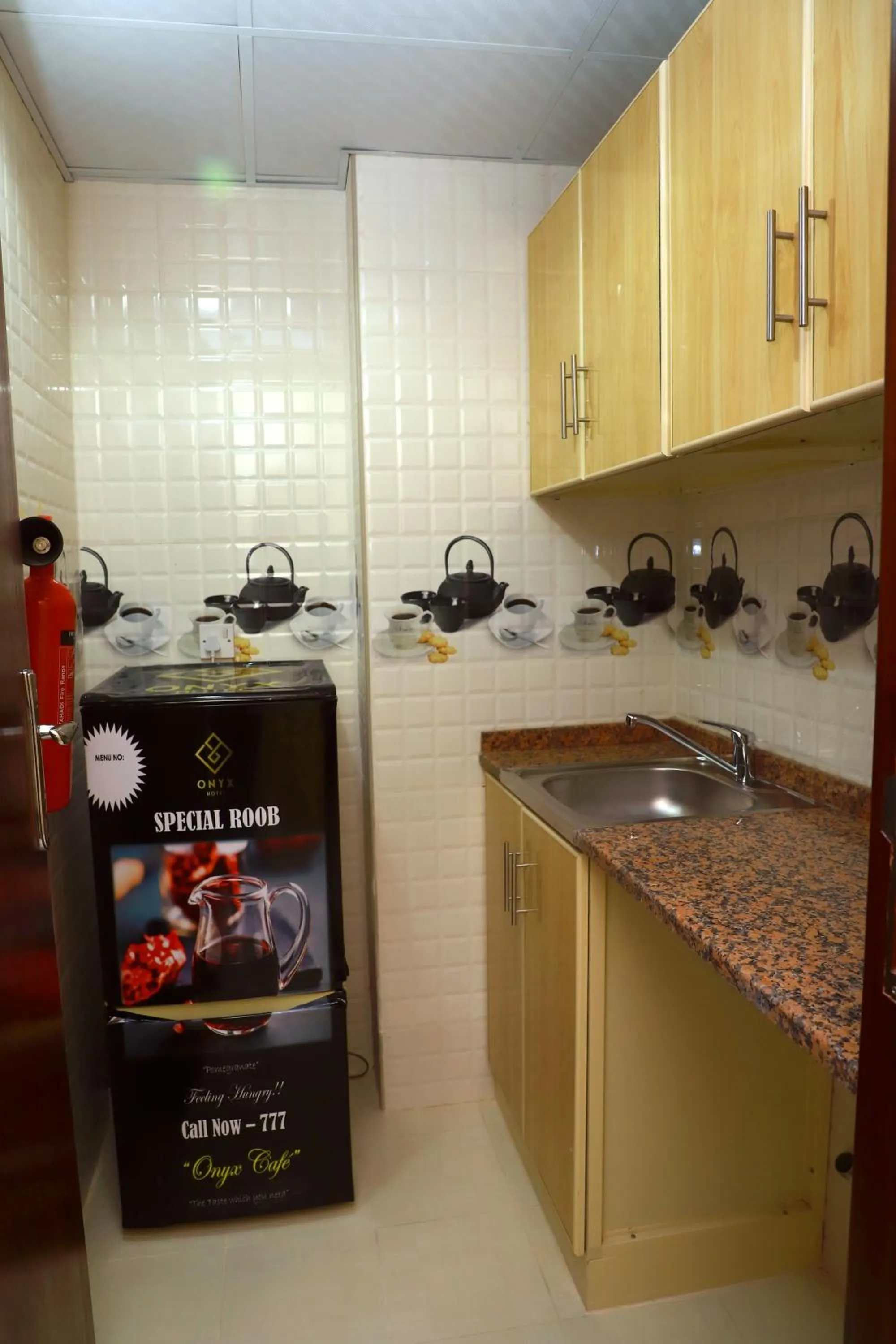 Kitchen or kitchenette in Onyx Hotel Apartments - MAHA HOSPITALITY GROUP