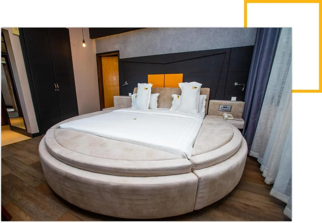 Bed in Gold Crest Hotel