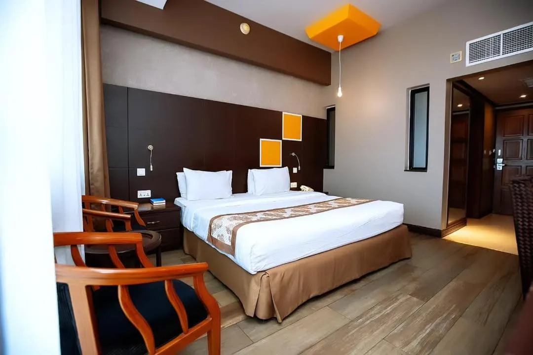 Bed in Gold Crest Hotel