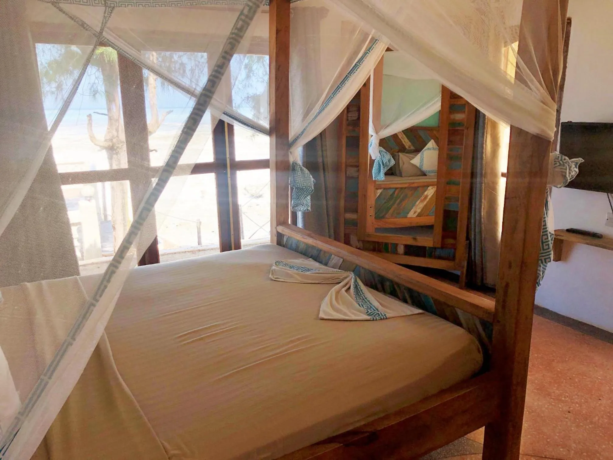 Bed in Reef & Beach Resort - Spa Jambiani