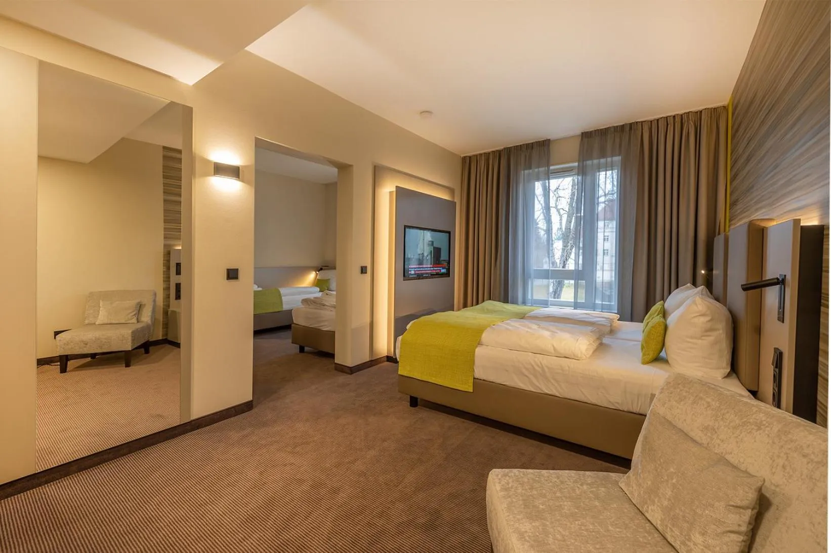 Photo of the whole room, Bed in th Hotel Leipzig Messe