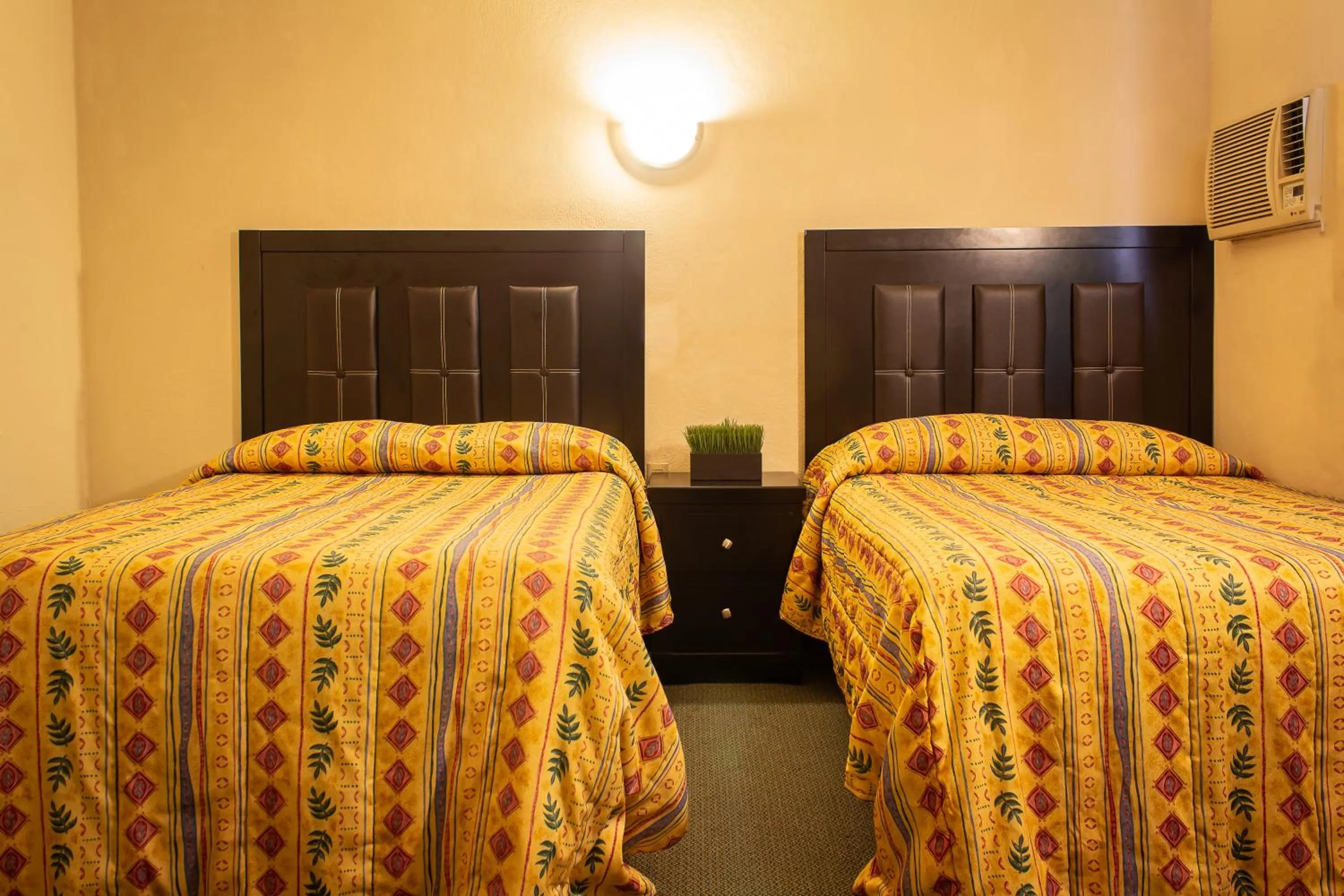 Bed in BONITTO INN® Manuel