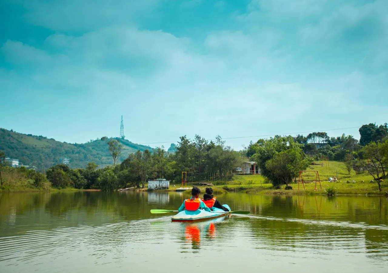 People in White Stone Vagamon Hilltop Cottage by VOYE HOMES