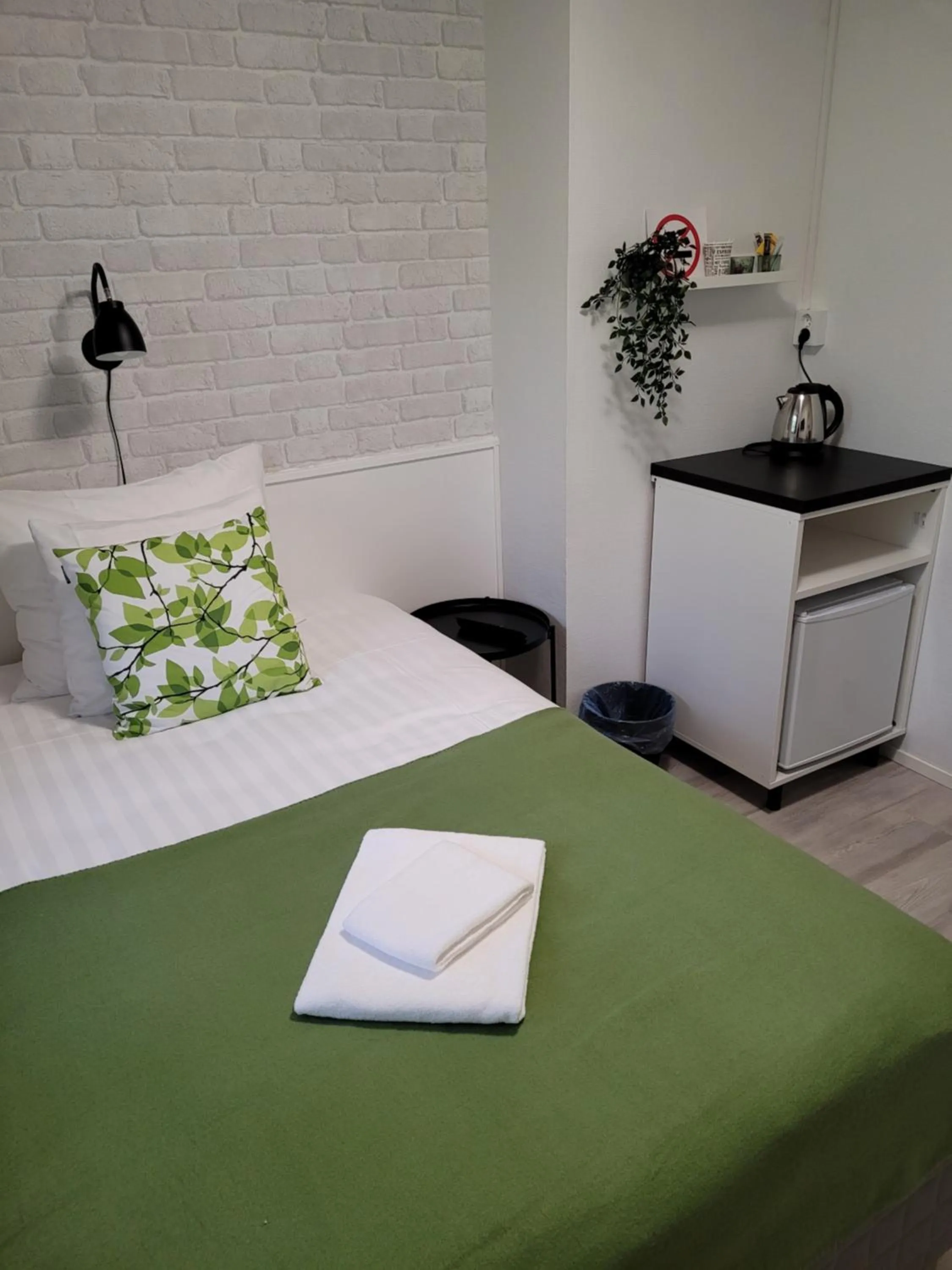 Photo of the whole room, Bed in Hotelli Salpakangas