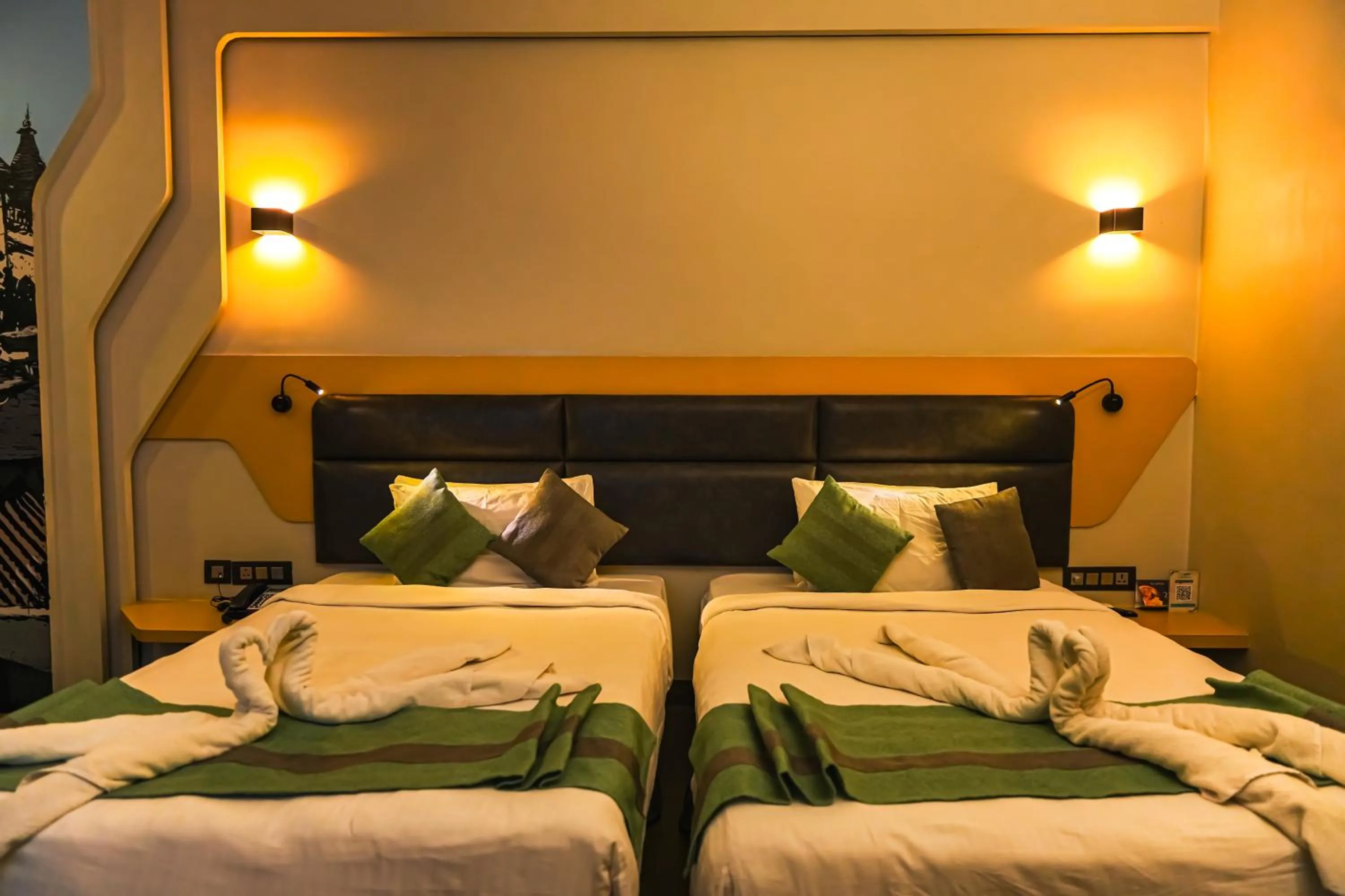 Bed in THE CENT HOTEL