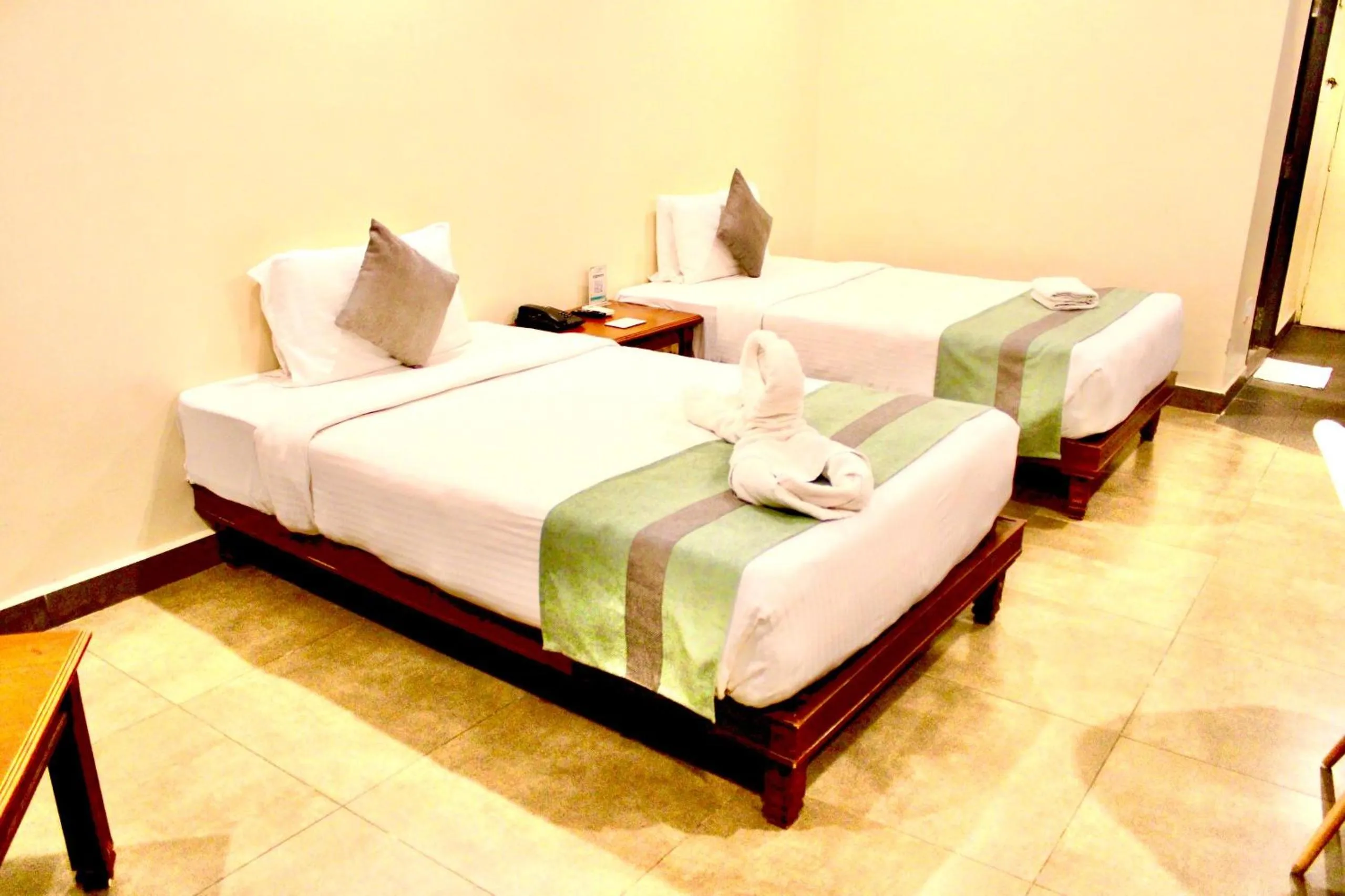 Bed in THE CENT HOTEL